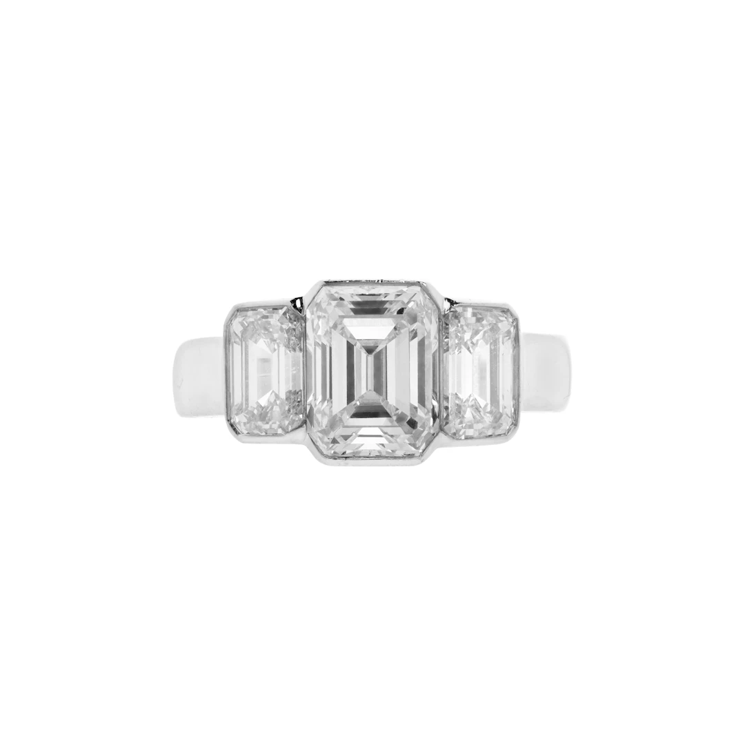 Platinum, 2.24ct Emerald Cut Diamond and Diamond Three Stone Engagement Ring