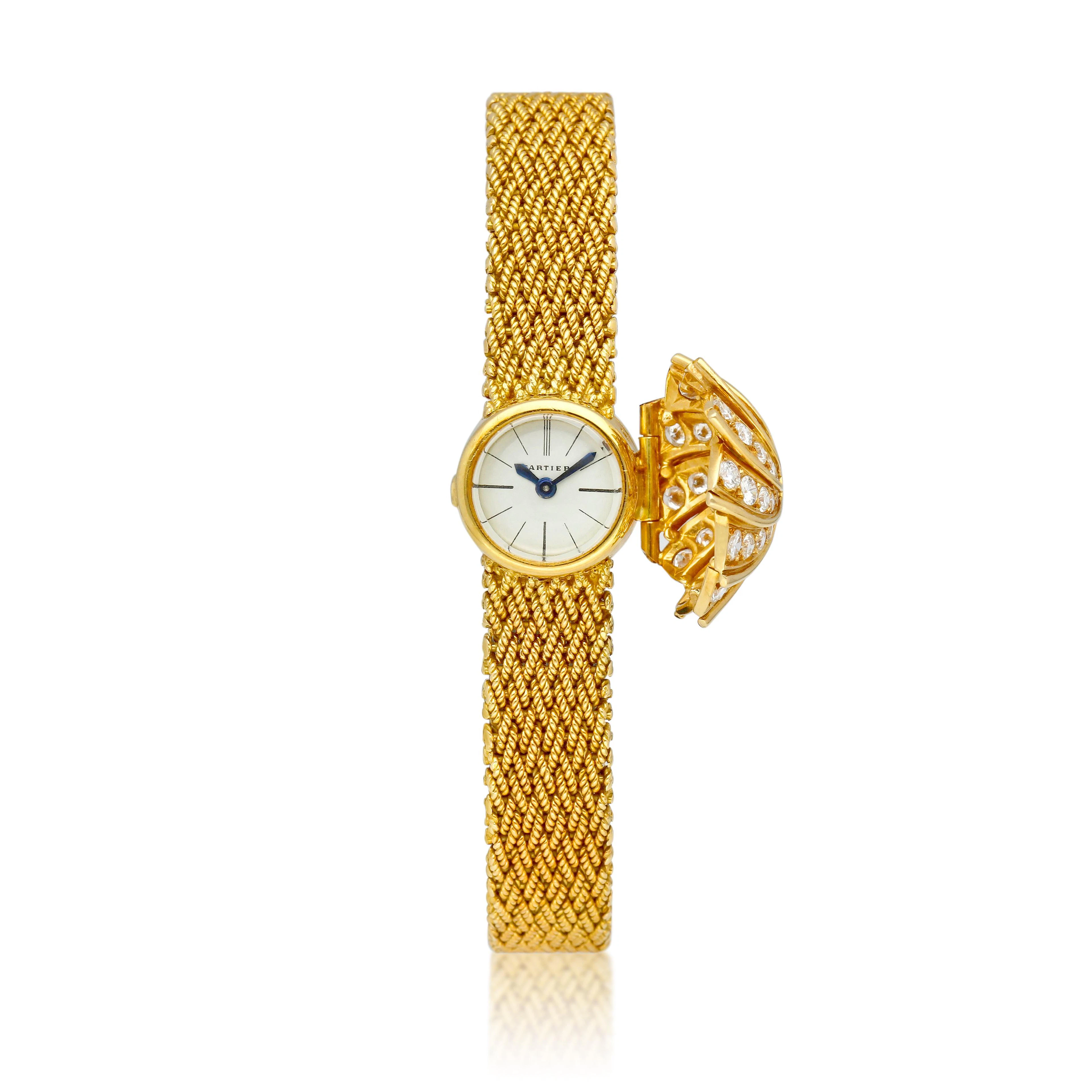 Cartier. A yellow gold and diamond-set manual wind bracelet watch