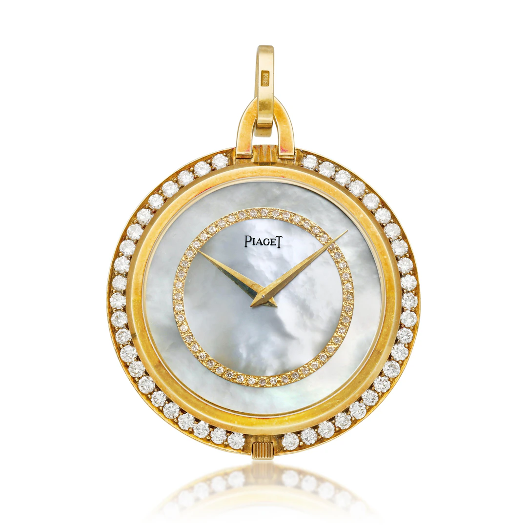 Piaget. A yellow gold and diamond-set open face manual wind watch