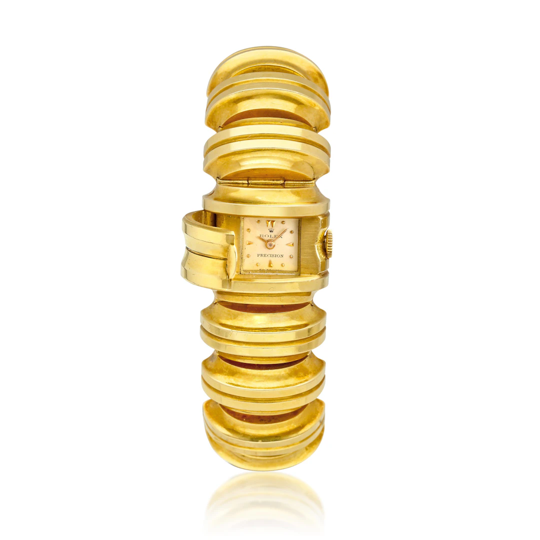Precision (Reference 4615). A 21.5mm yellow gold manual wind bracelet