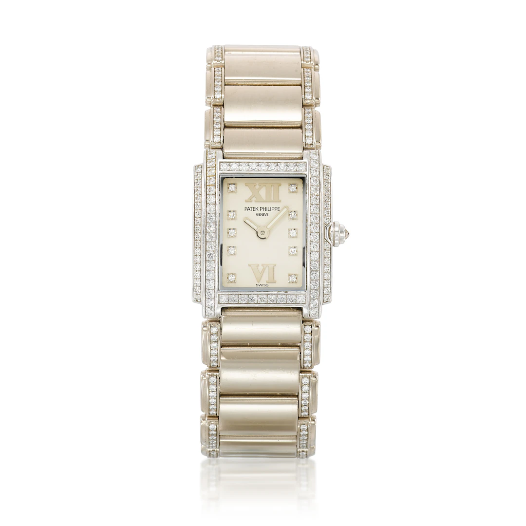 Twenty-4 (Reference 4908G). A 26.3mm white gold diamond-set quartz
