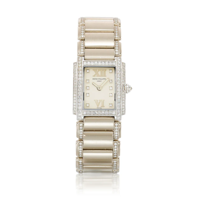 Twenty-4 (Reference 4908G). A 26.3mm white gold diamond-set quartz