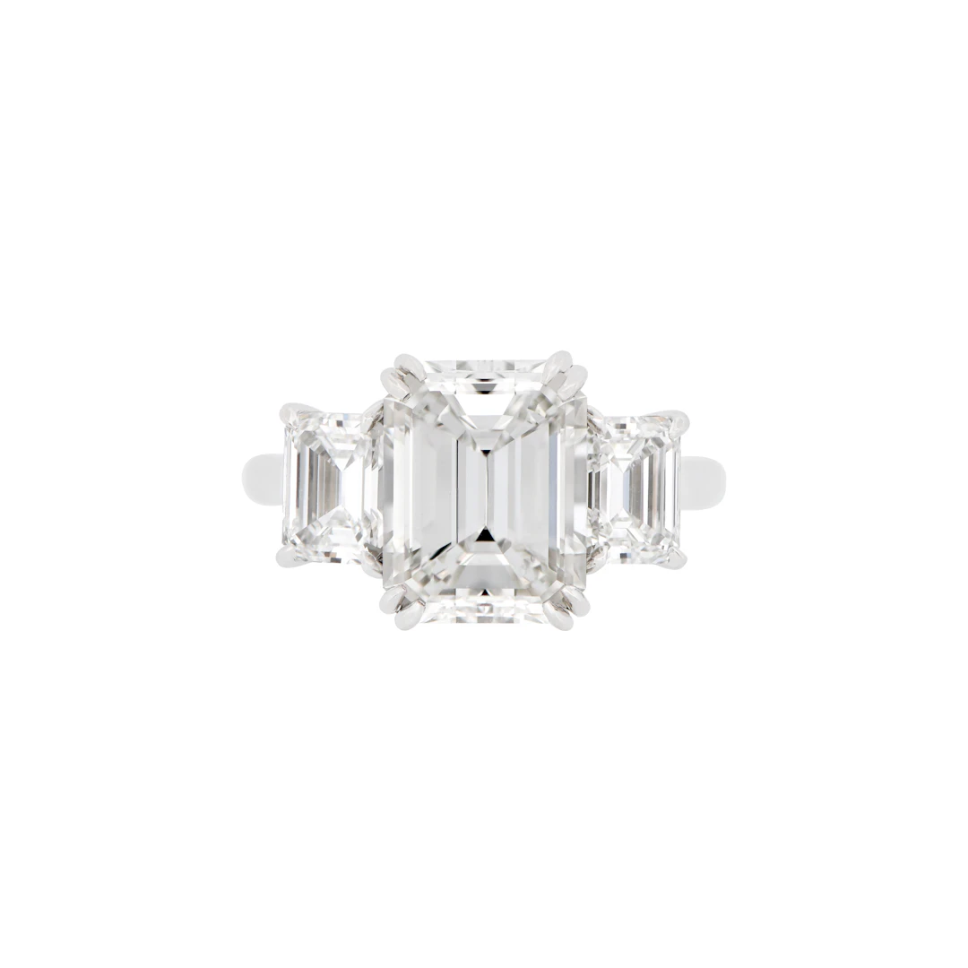 Platinum, 4.02ct Emerald Cut Diamond and Diamond Three Stone Engagement Ring