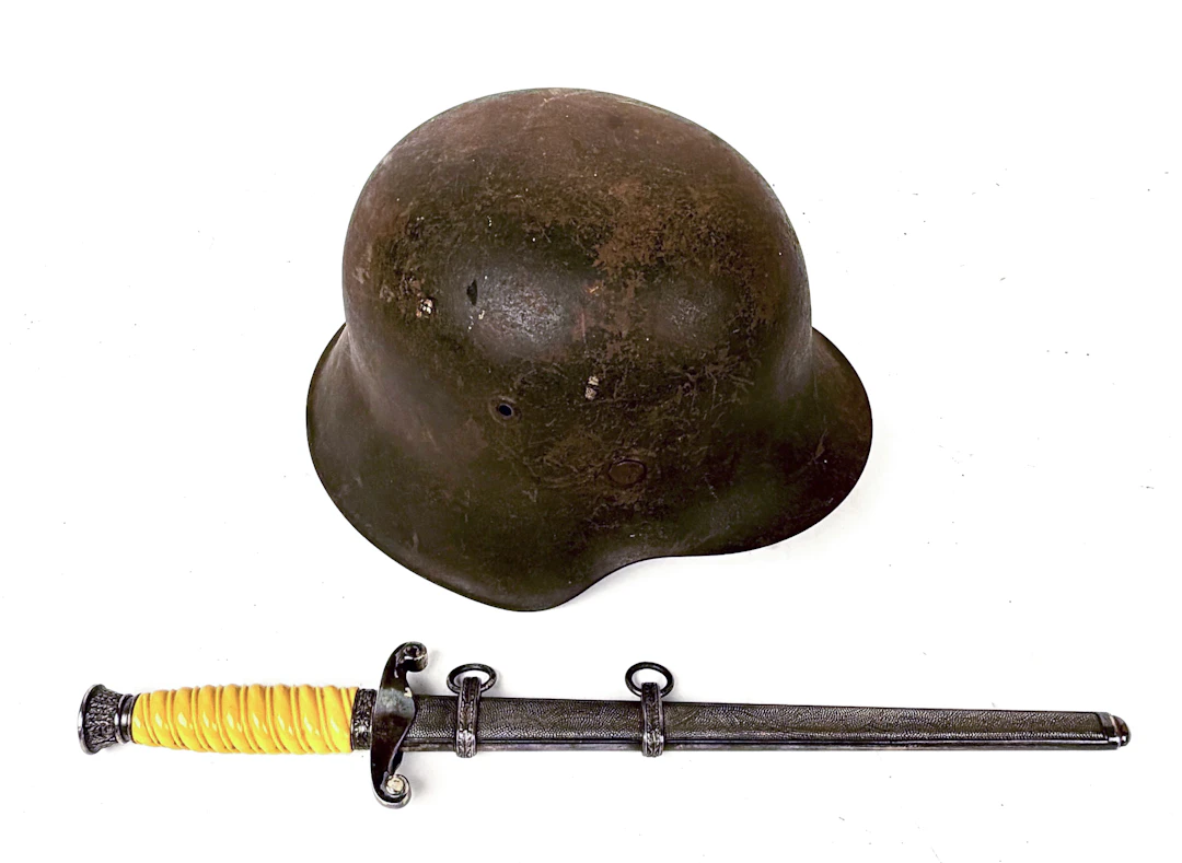 20TH C. GERMAN WWII ARMY DAGGER AND M42 HELMET.