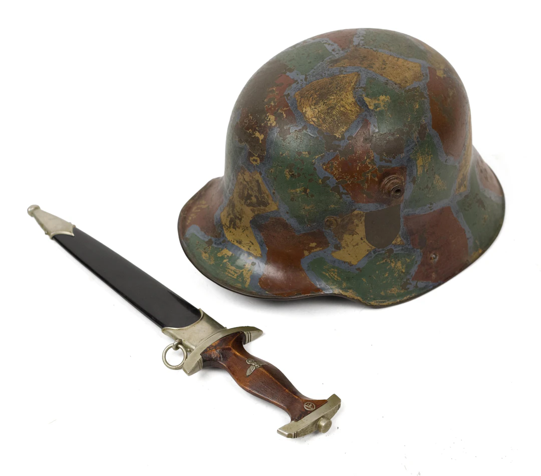 20TH C. GERMAN CAMOUFLAGE HELMET AND NSKK DAGGER.