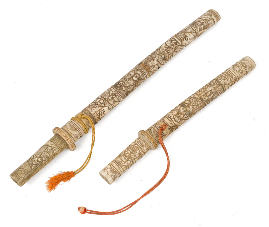TWO EARLY 20TH C. ASIAN CARVED BONE DAGGERS.