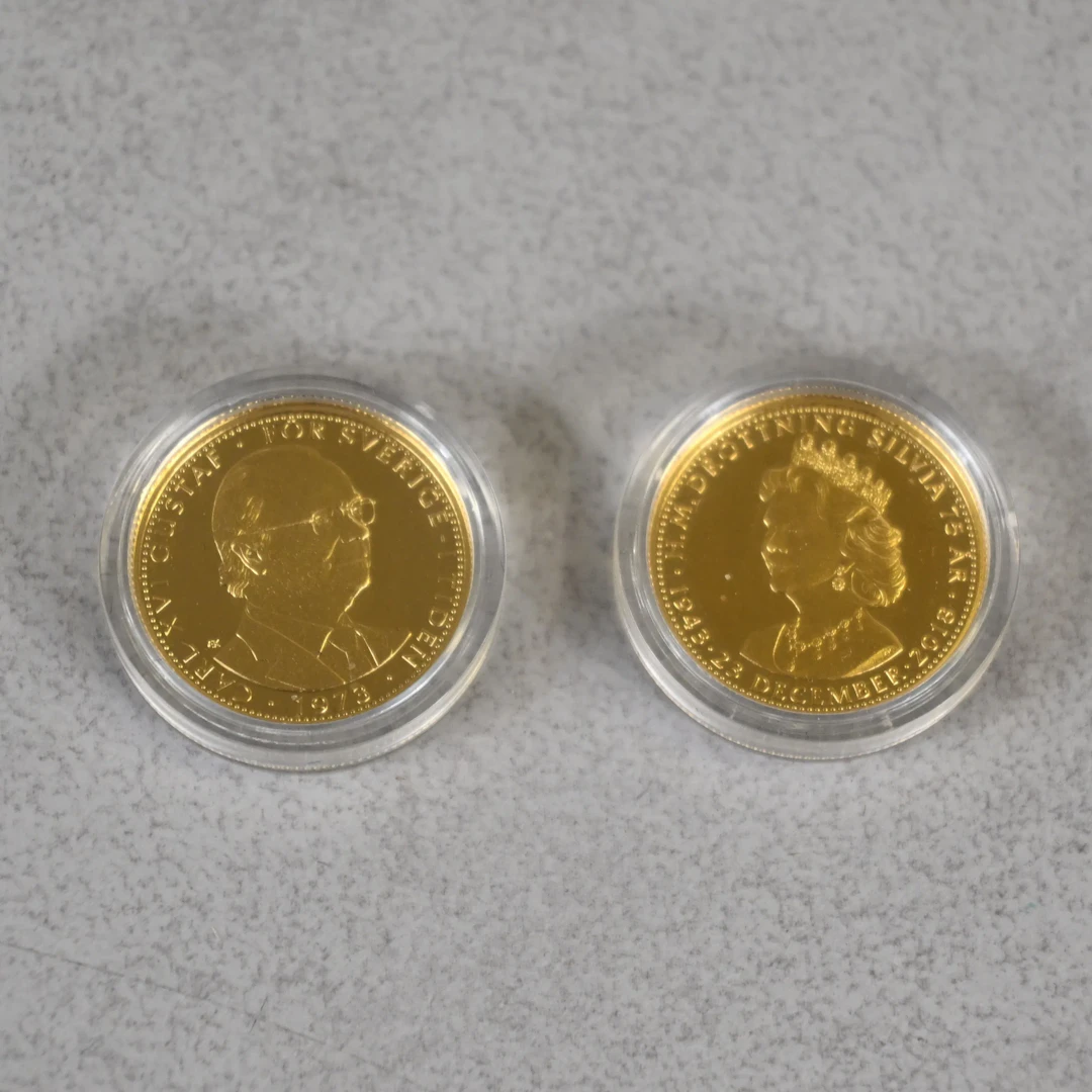 Medaljer, 2st, 24k guld, Kungariket Sverige.