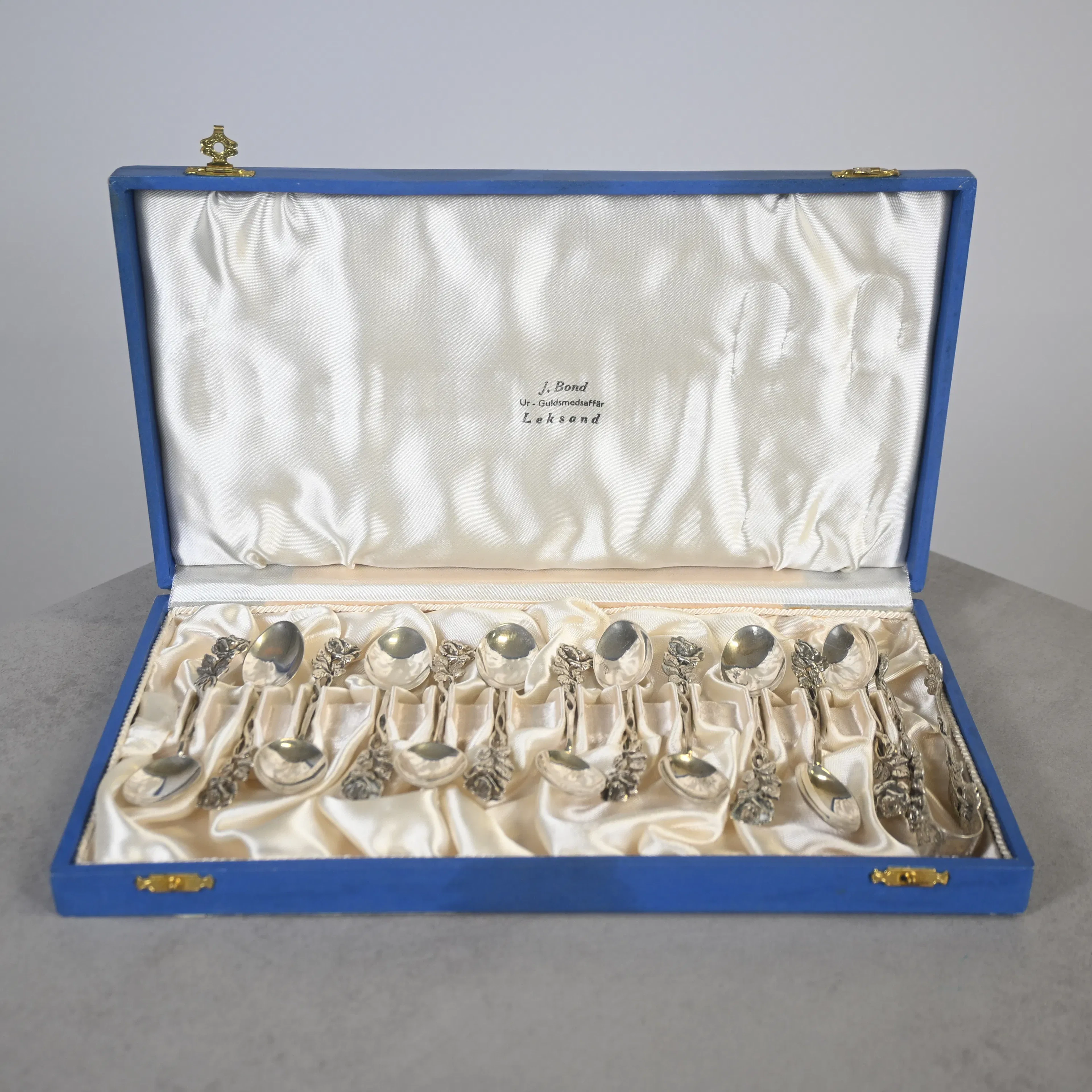 Kaffeskedar, 12st, samt sockertång, silver, 1965.