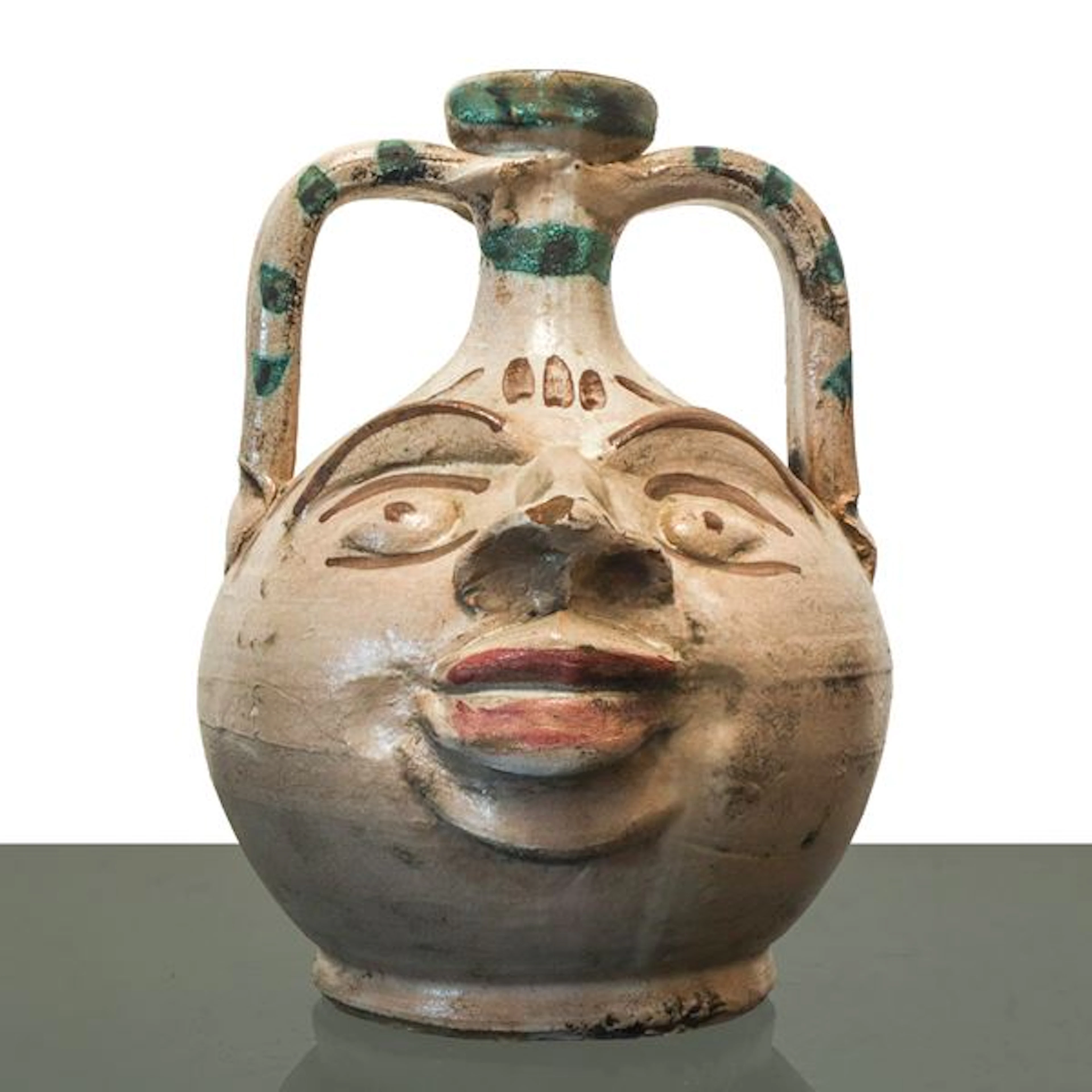 Brocca in maiolica di Caltagirone dalle fattezze antropomorfe decorata