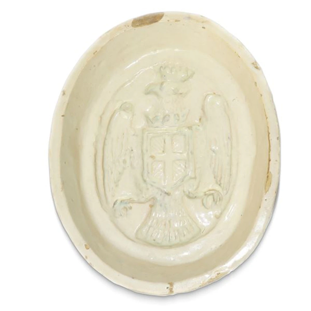 Formella ovale in maiolica di Caltagirone con stemma della città