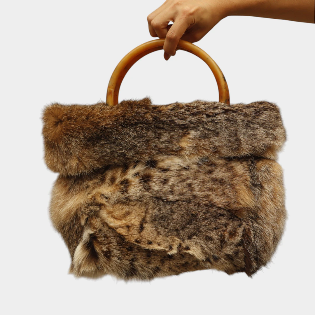 Bolso en piel con asas de asta.