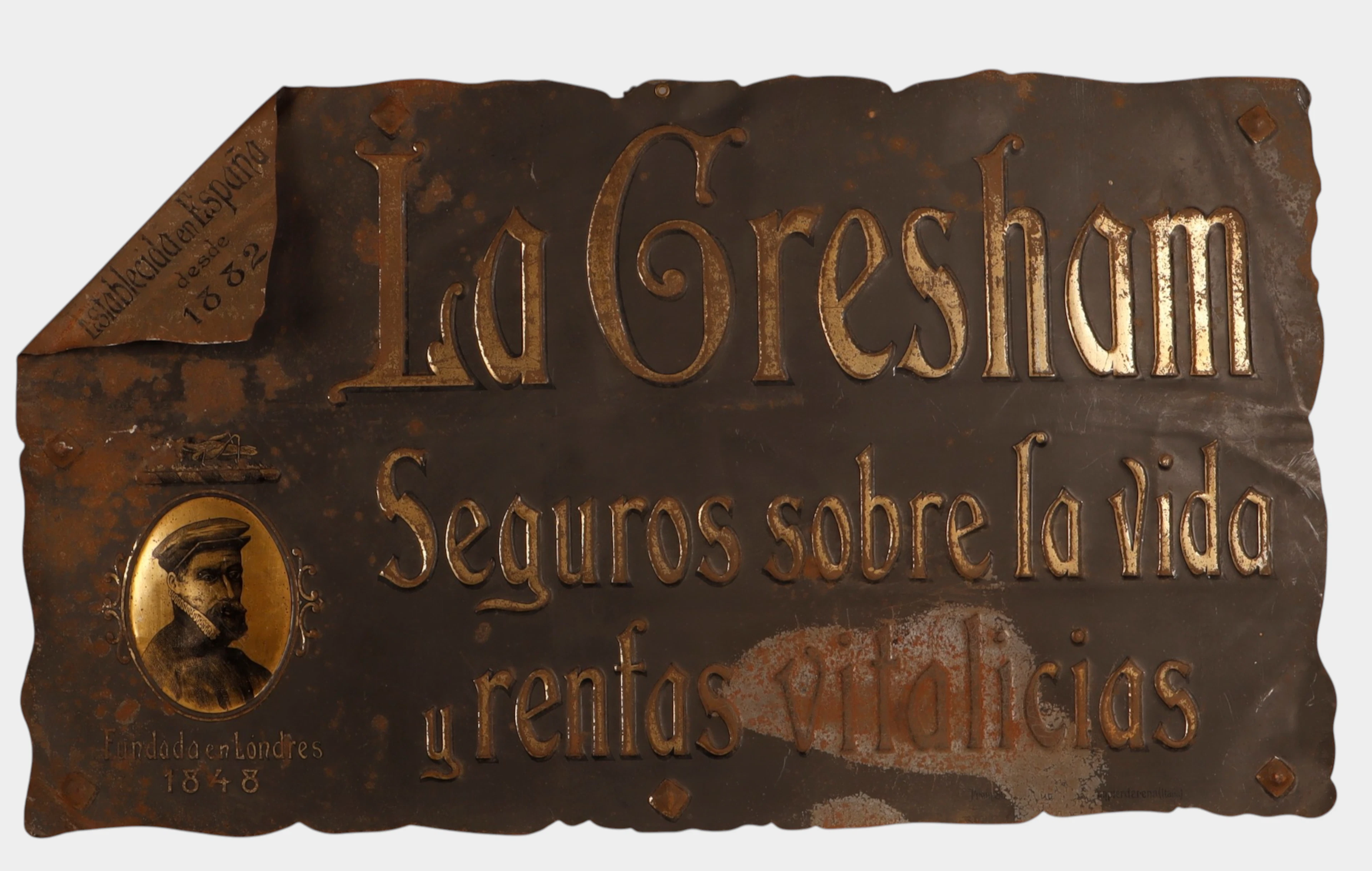 La Gresham, placa de chapa en relieve, parcialmente litografiada y dorada.