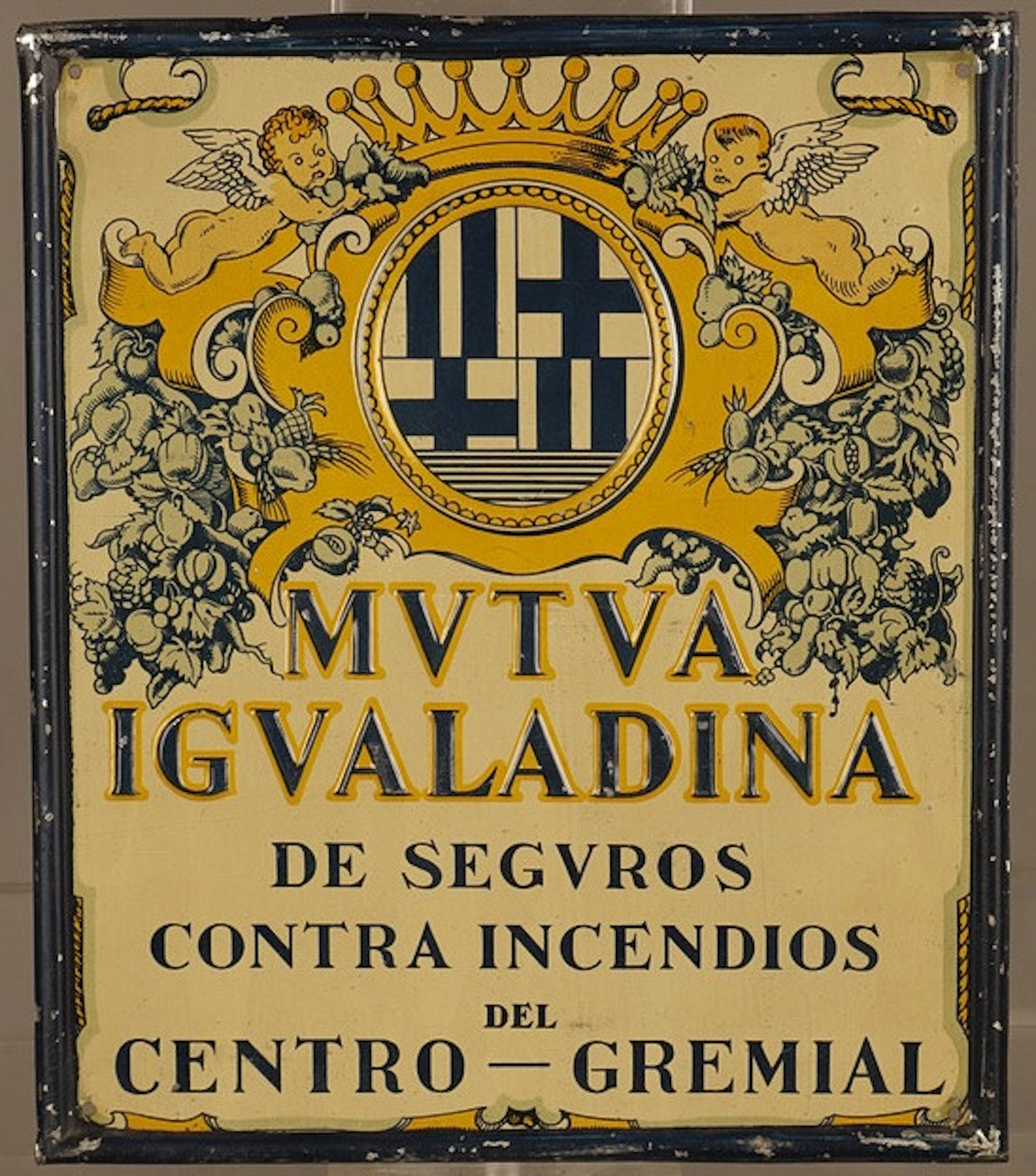 Mutua Igualadina, placa publicitaria en hojalata estampada y litografiada.