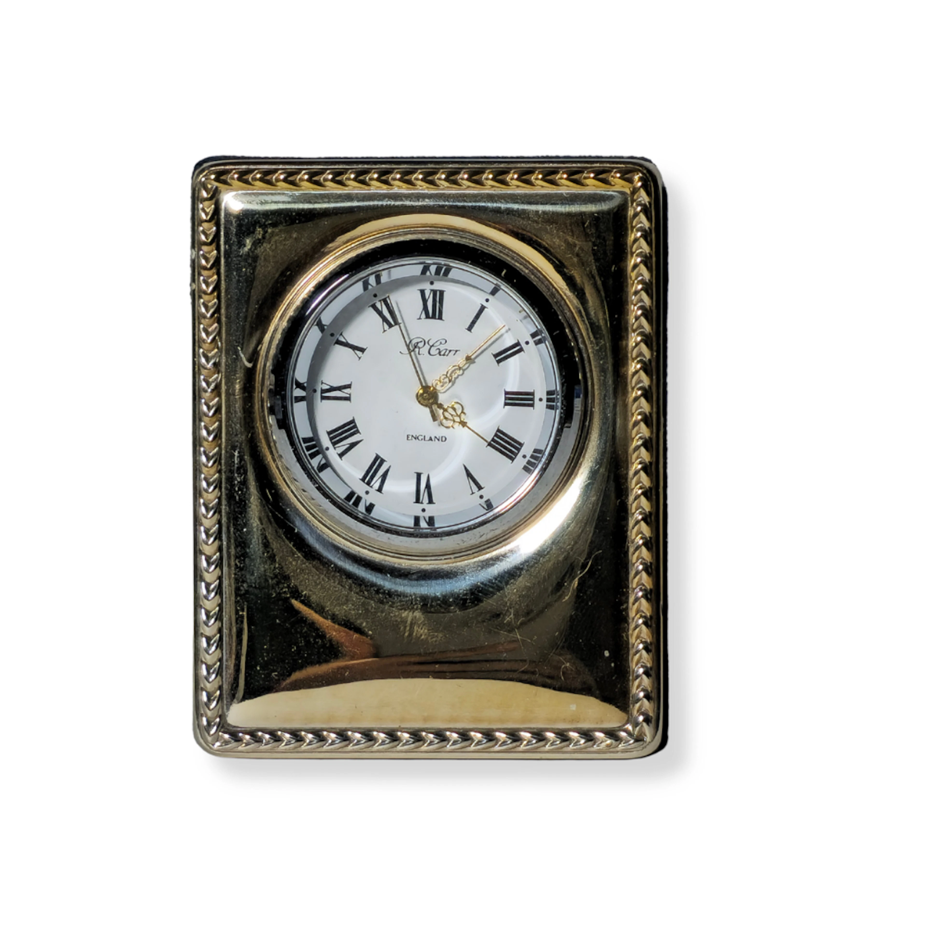 RELOJ DE VIAJE CON MARCO DE PLATA PUNZONADA. R. CARR ENGLAND.
