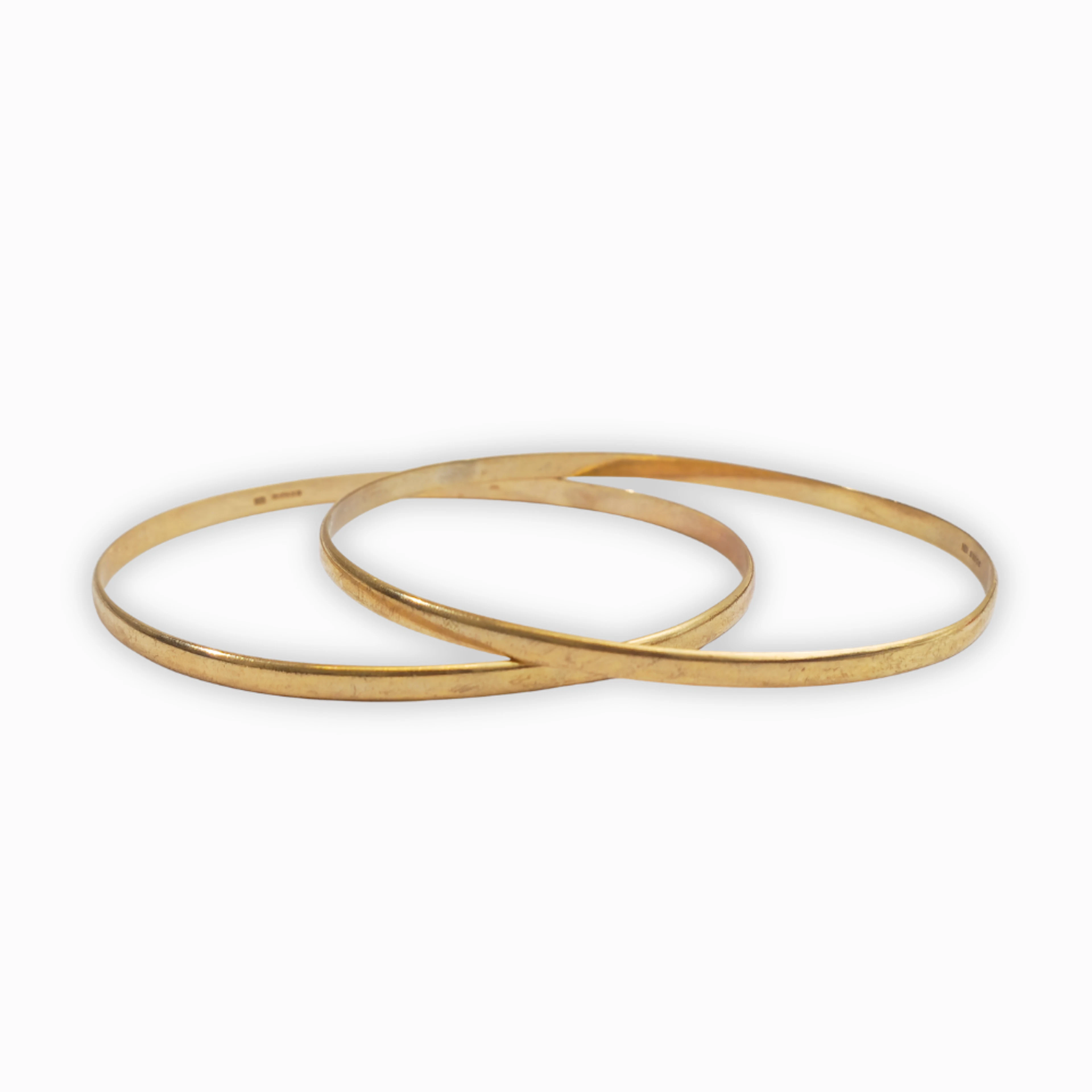 Dos pulseras esclavas en oro de 9 K.