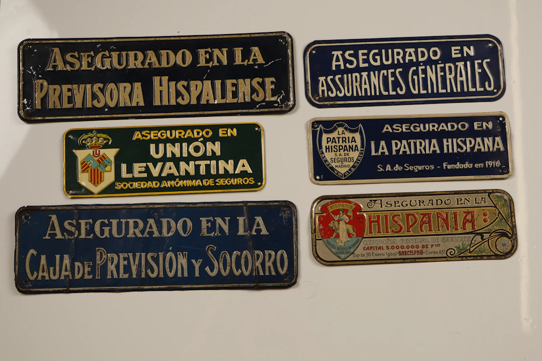 Hispania y otros. 6 placas publicitarias en hojalata estampada, litografiada