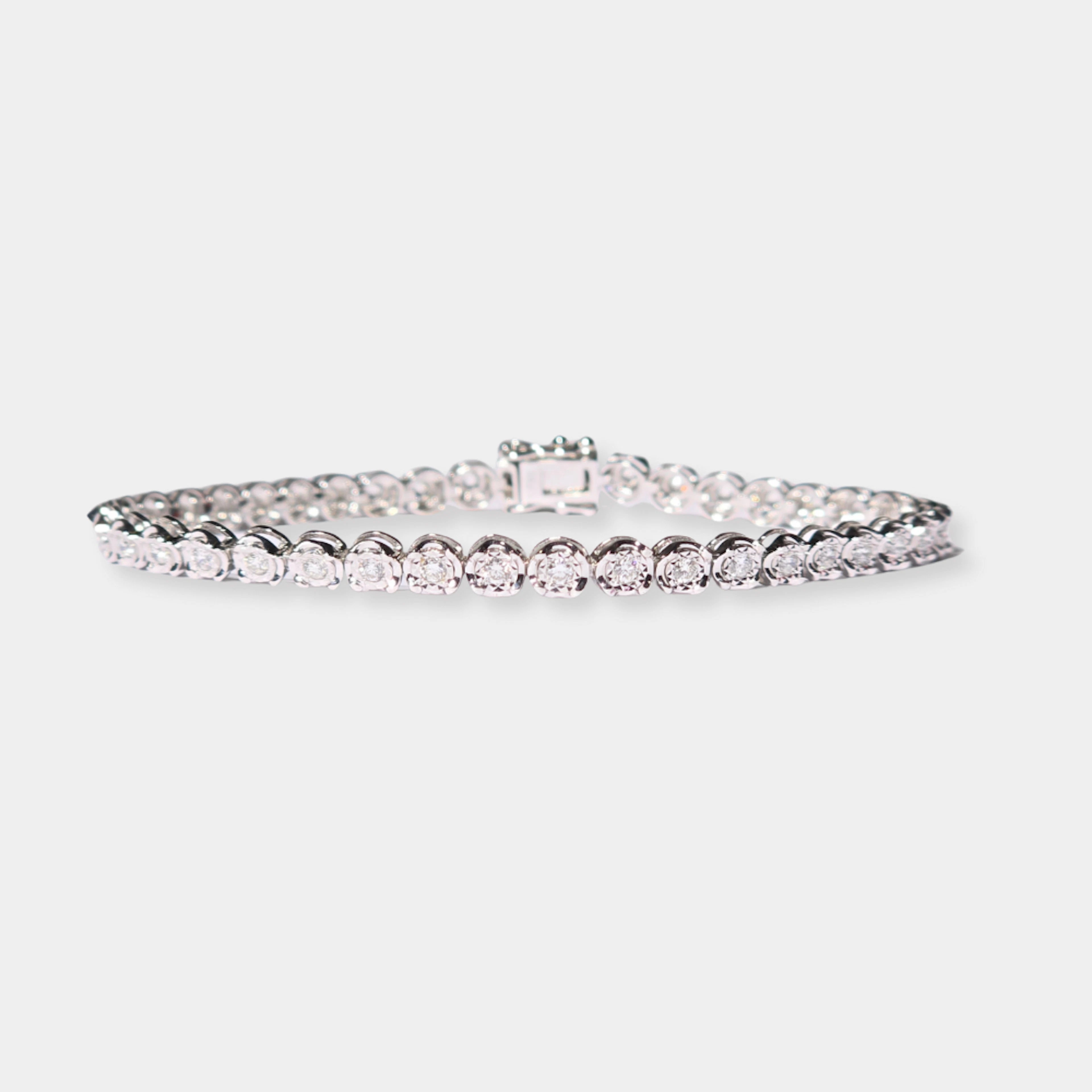 PULSERA RIVIERE EN ORO BLANCO DE 10 K Y DIAMANTES.