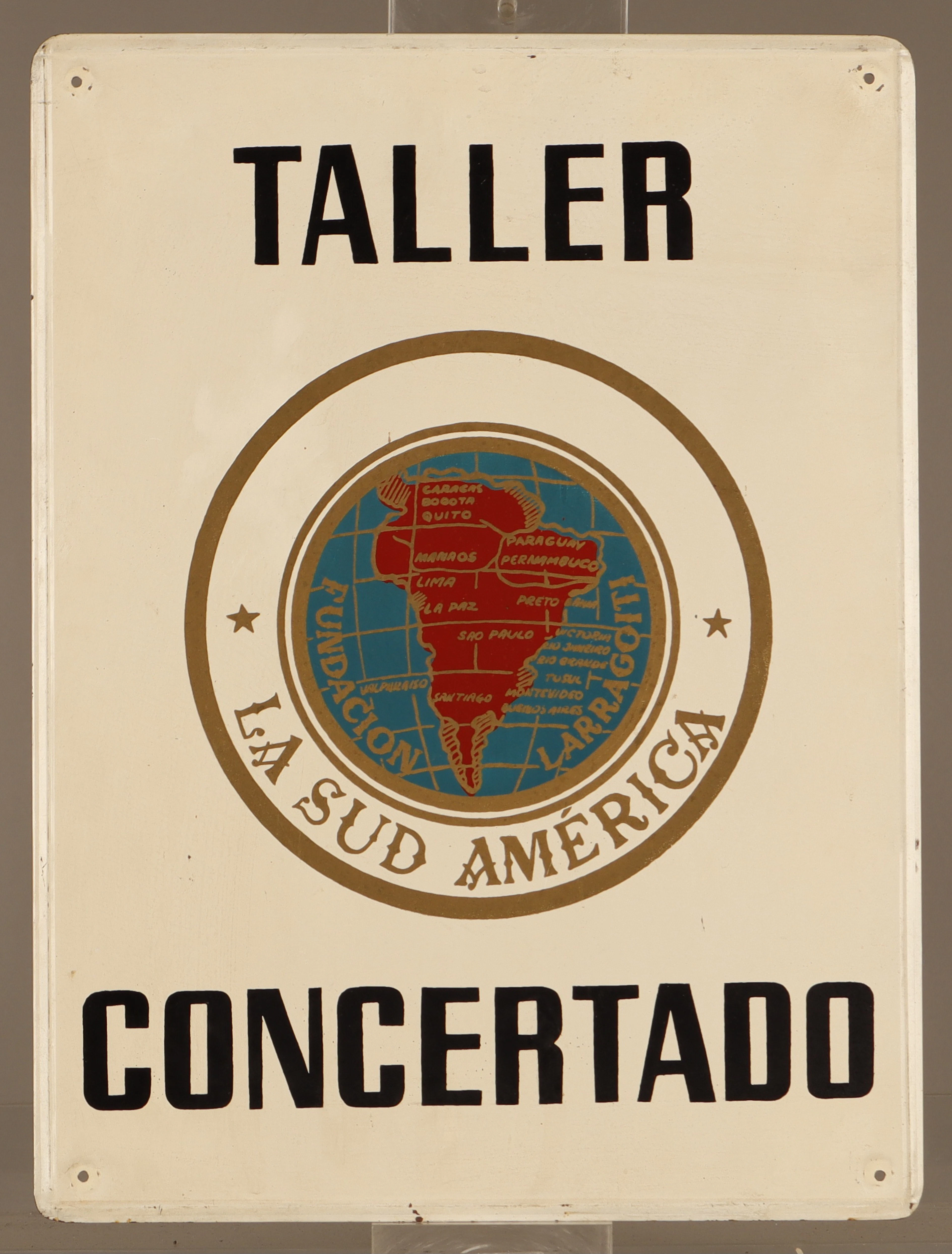 La Sud América, placa publicitaria en hojalata pintada.