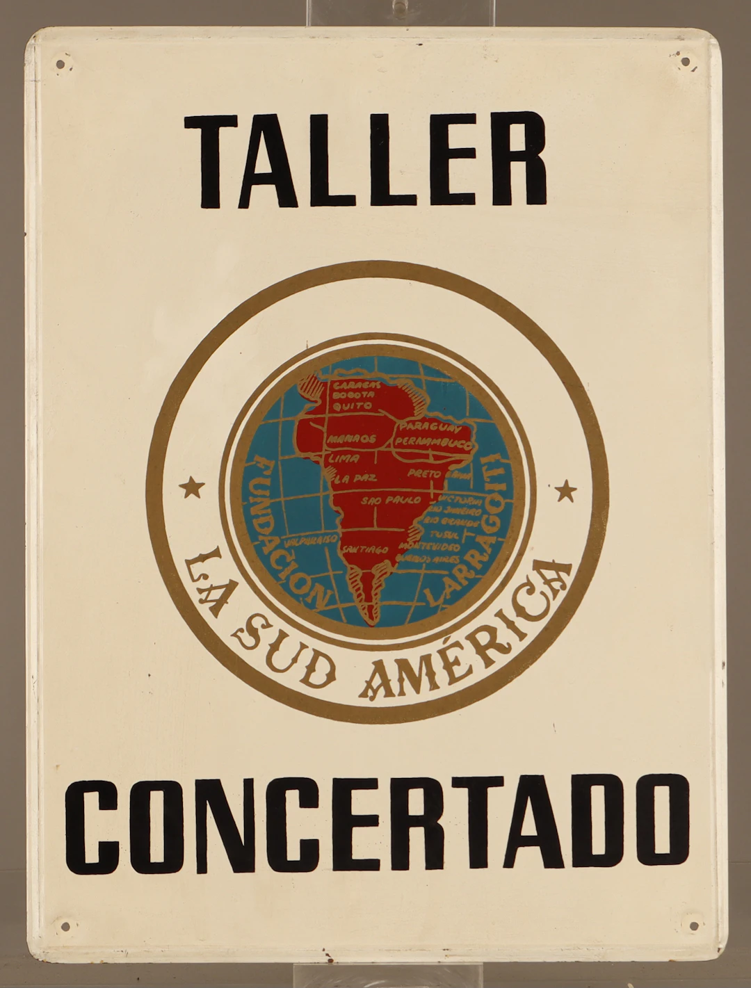 La Sud América, placa publicitaria en hojalata pintada.