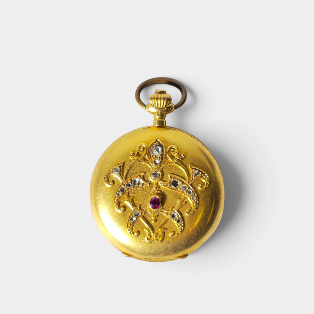 Reloj de bolsillo Invicta de sra en oro de 18k, con diamantes y rubí.