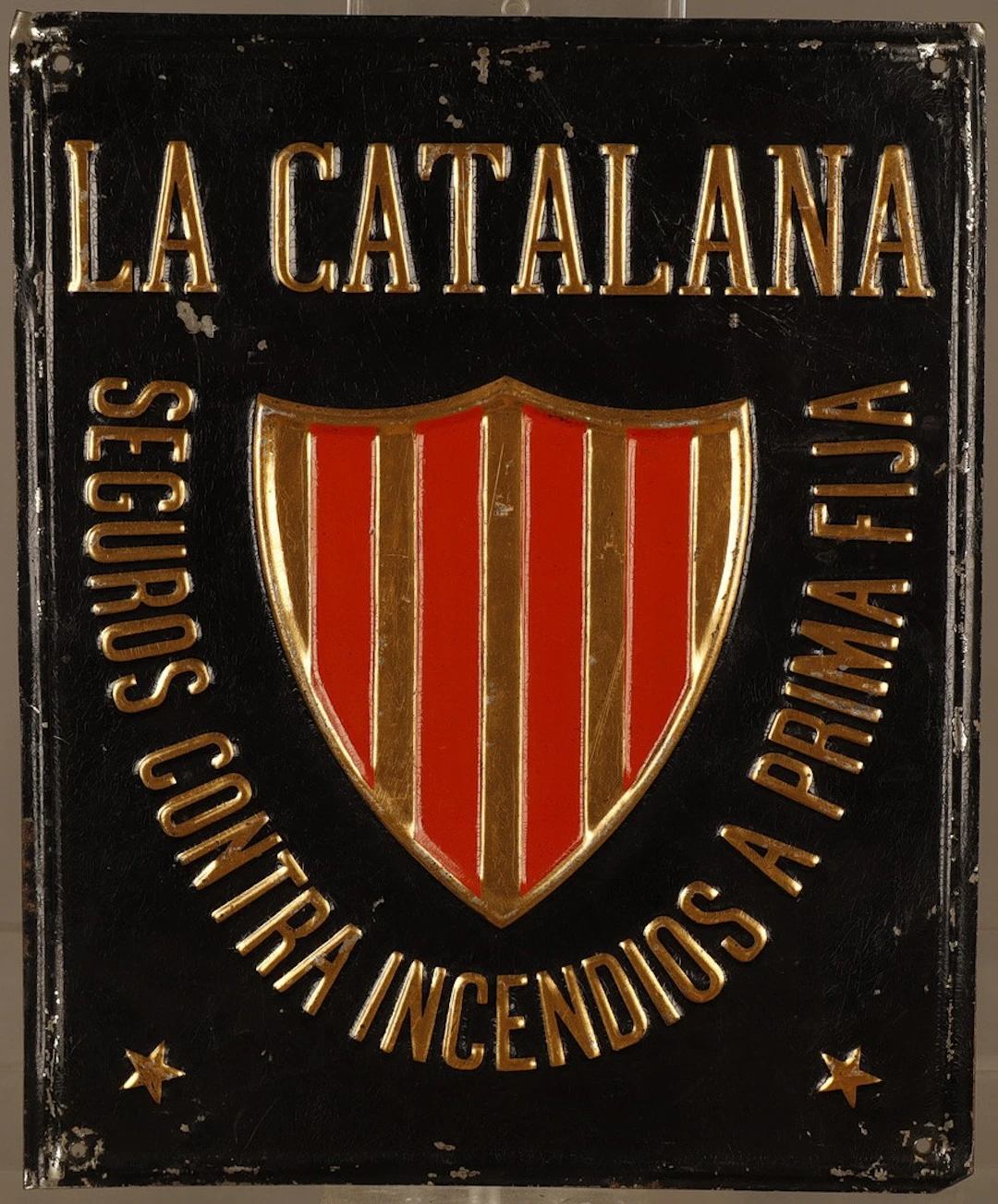 La Catalana, placa publicitaria en hojalata estampada y pintada.
