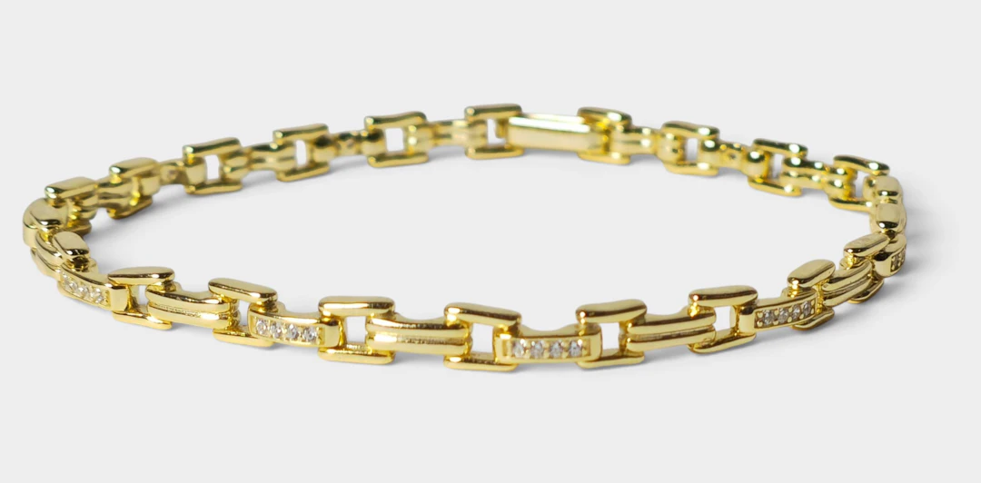Pulsera en plata con baño de oro y circonitas.