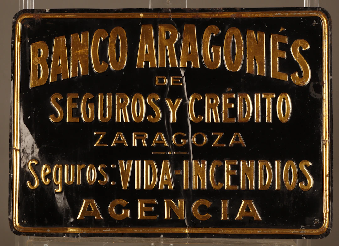 Banco Aragonés de Seguros y Crédito, placa publicitaria en hojalata