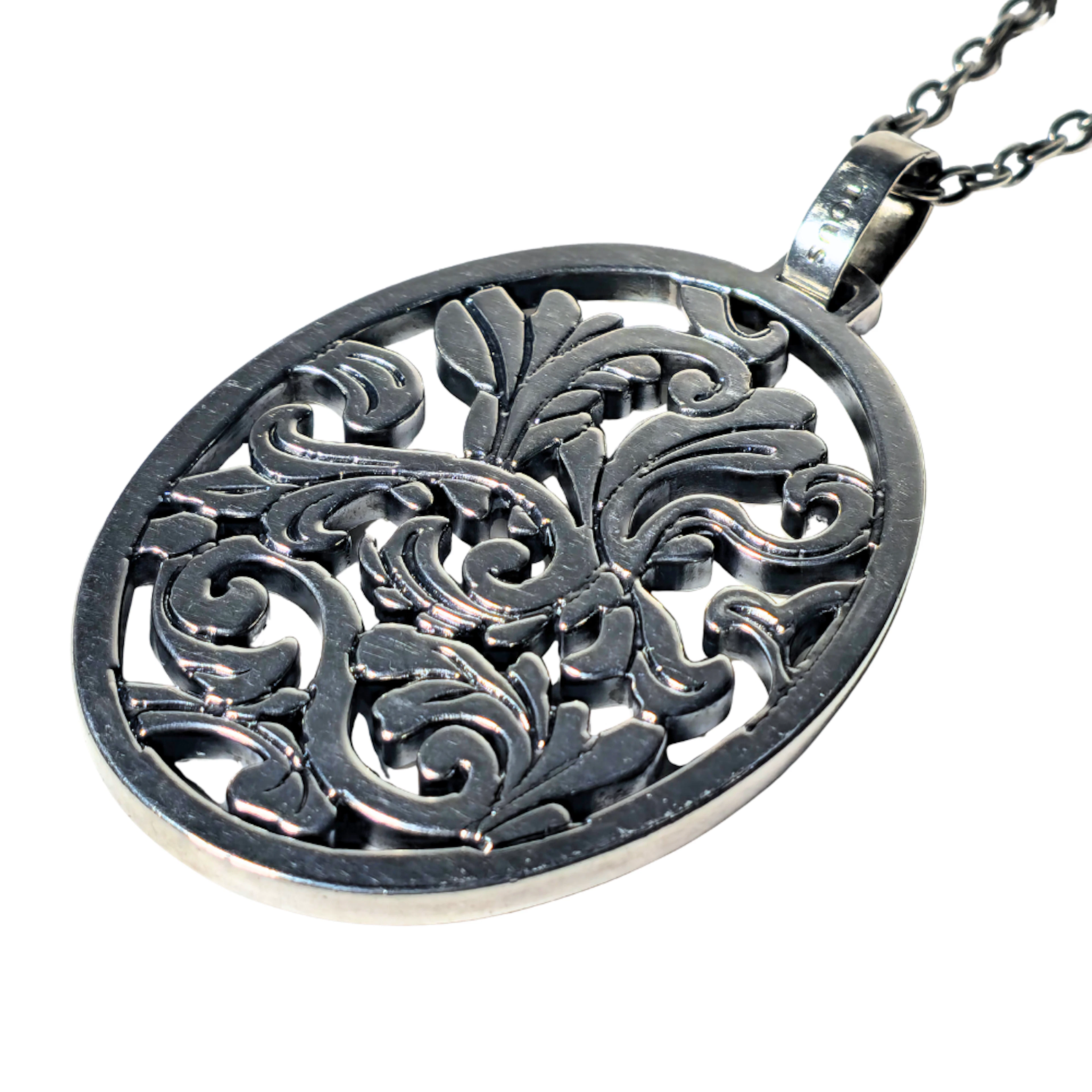 TOUS. COLGANTE EN PLATA CALADA FORMANDO ROLEOS. COLECCIÓN VIRTUAL GARDEN.