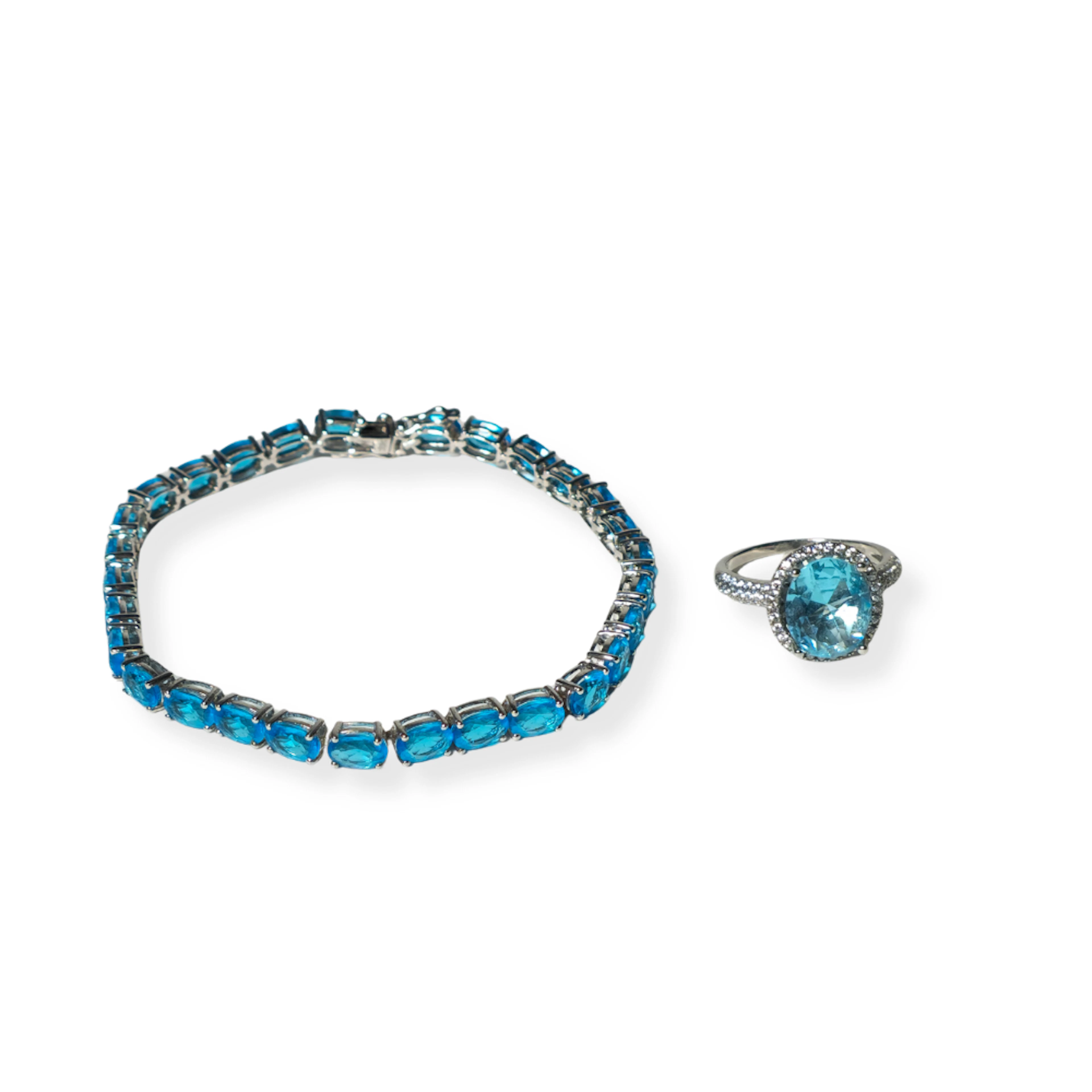 PULSERA Y ANILLO ROSETÓN EN PLATA Y TOPACIO AZUL.