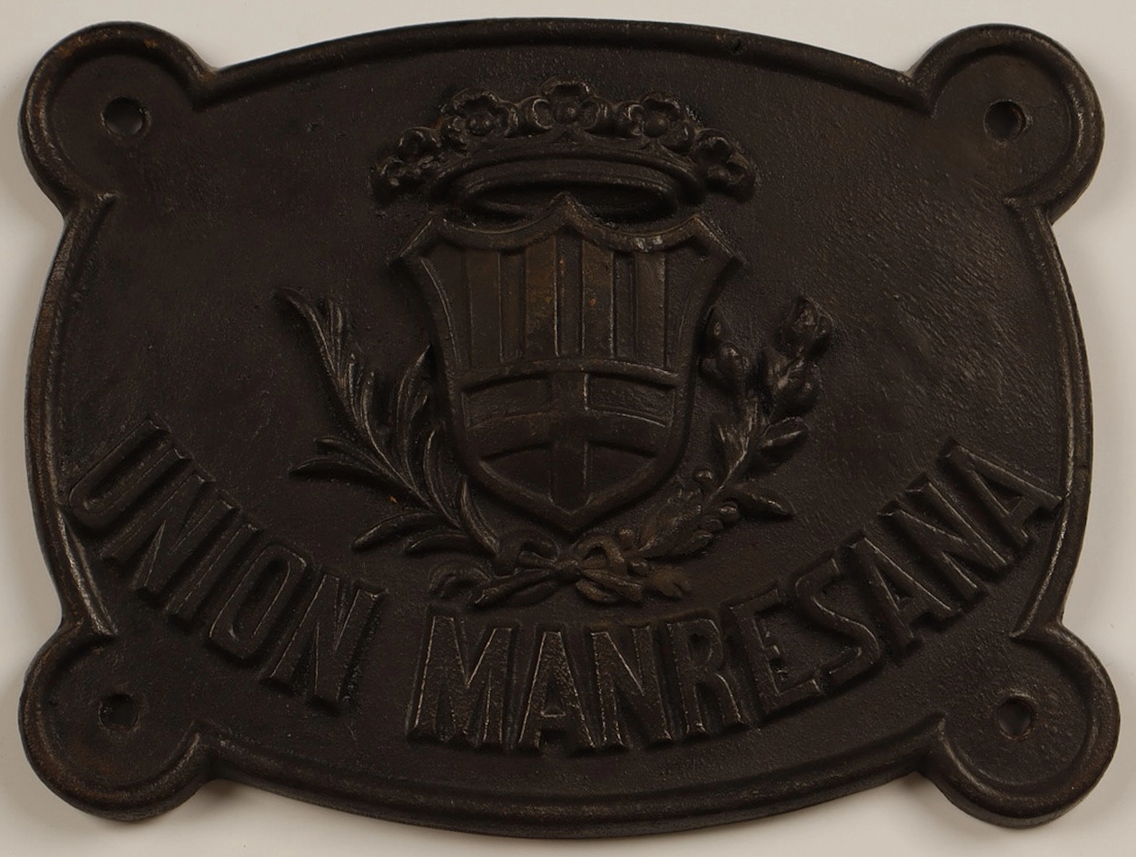 Unión Manresana, placa publicitaria en hierro colado.