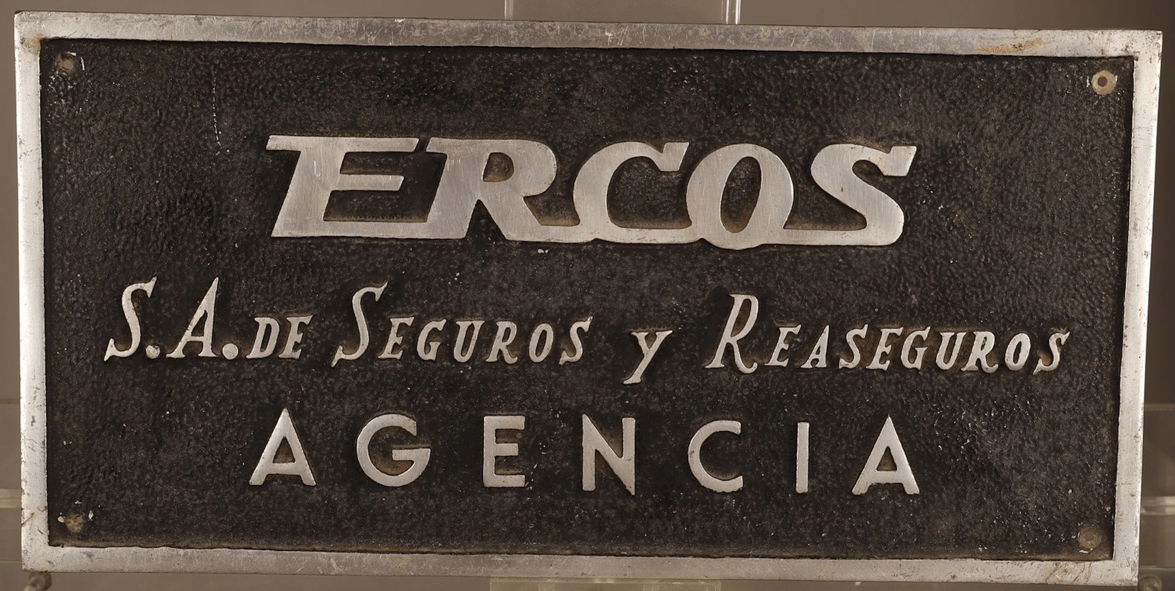 Ercos, placa publicitaria en aluminio.