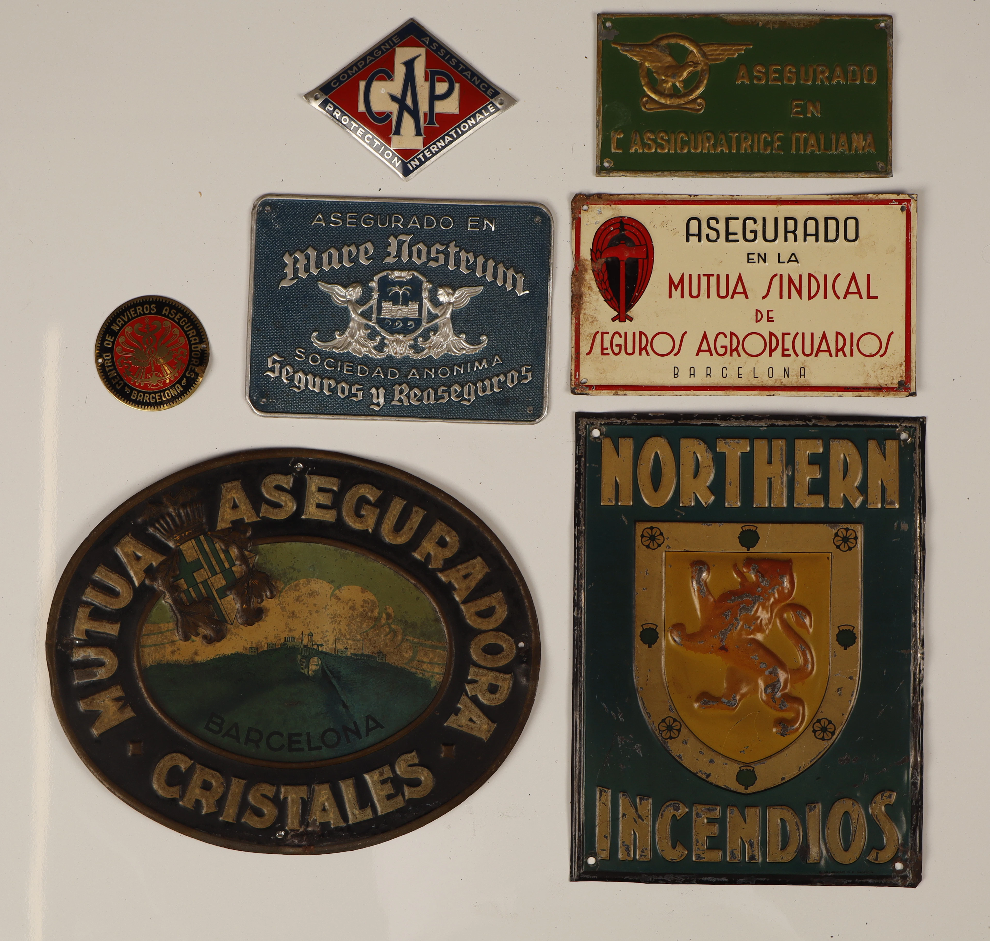 orthern y otros, 7 placas publicitarias en hojalata estampada y pintada.