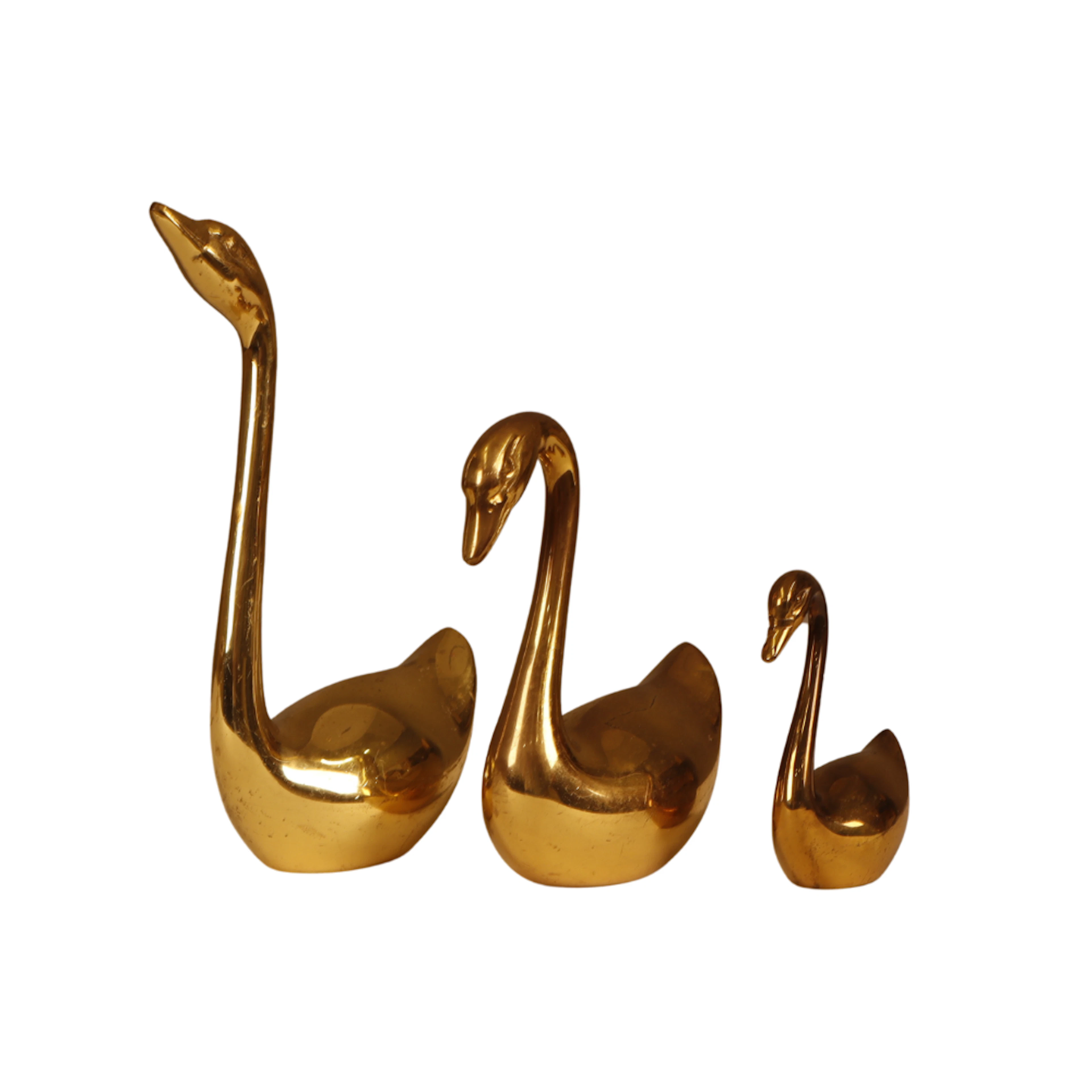 3 cisnes en bronce.