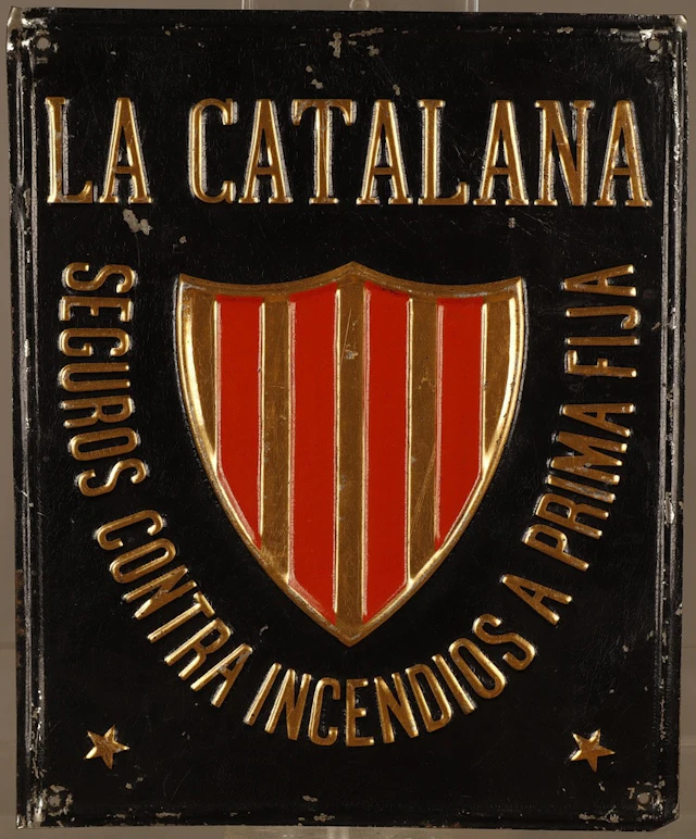 La Catalana, placa publicitaria en hojalata estampada y pintada.