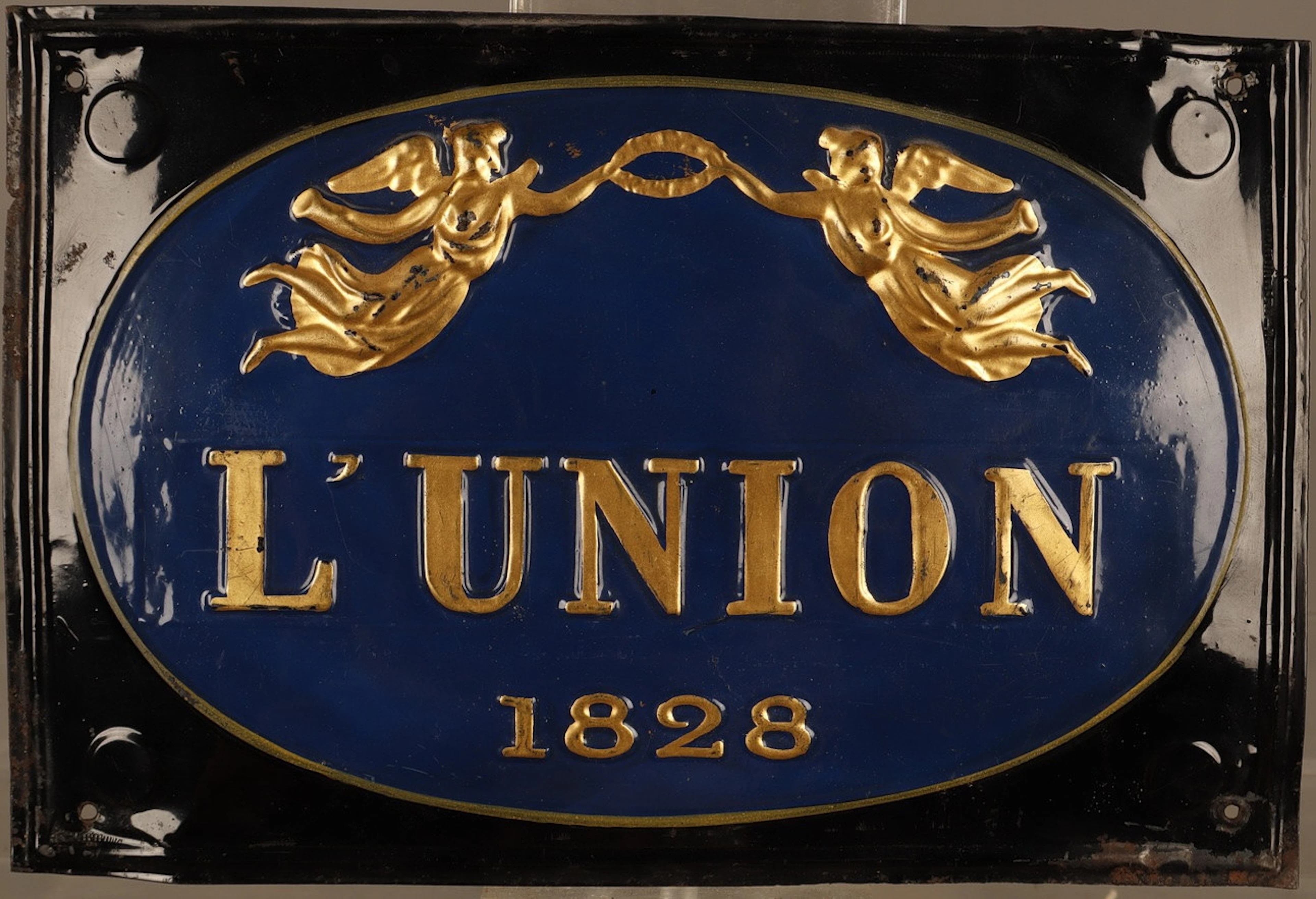 L'Union, placa publicitaria en hojalata estampada y pintada.