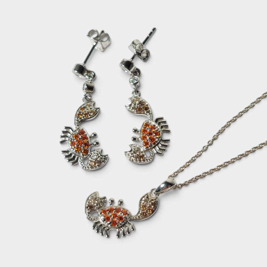 Pendientes y collar "cangrejo" en plata y circonitas.