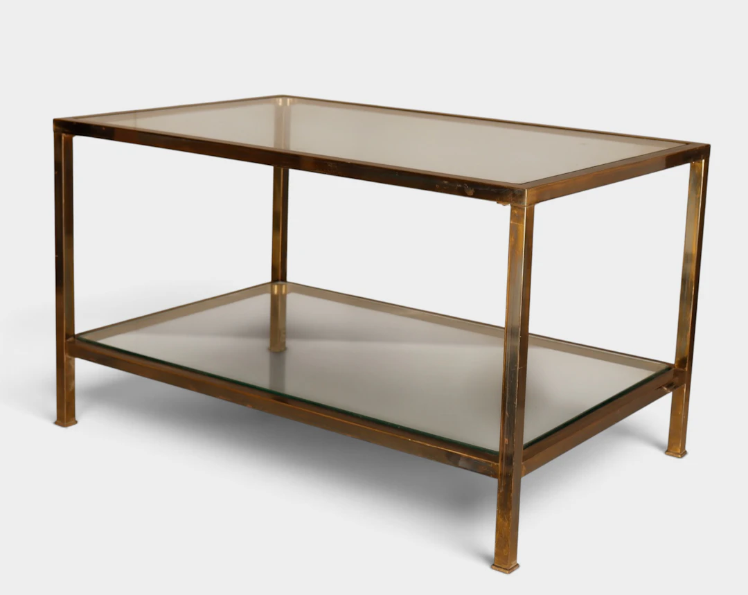 Mesa auxiliar vintage en latón dorado y vidrio.