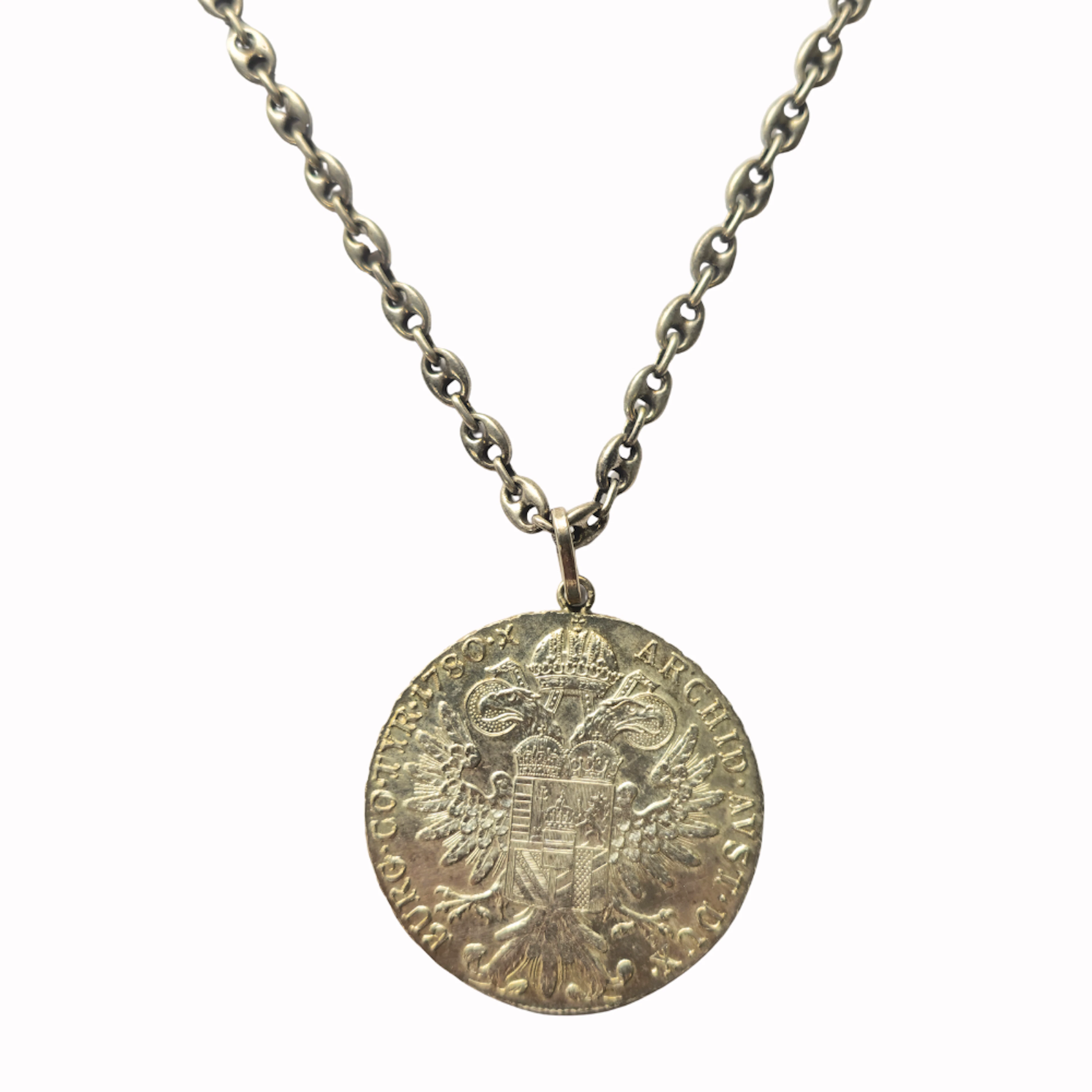 Cadena calabrote y moneda en plata.