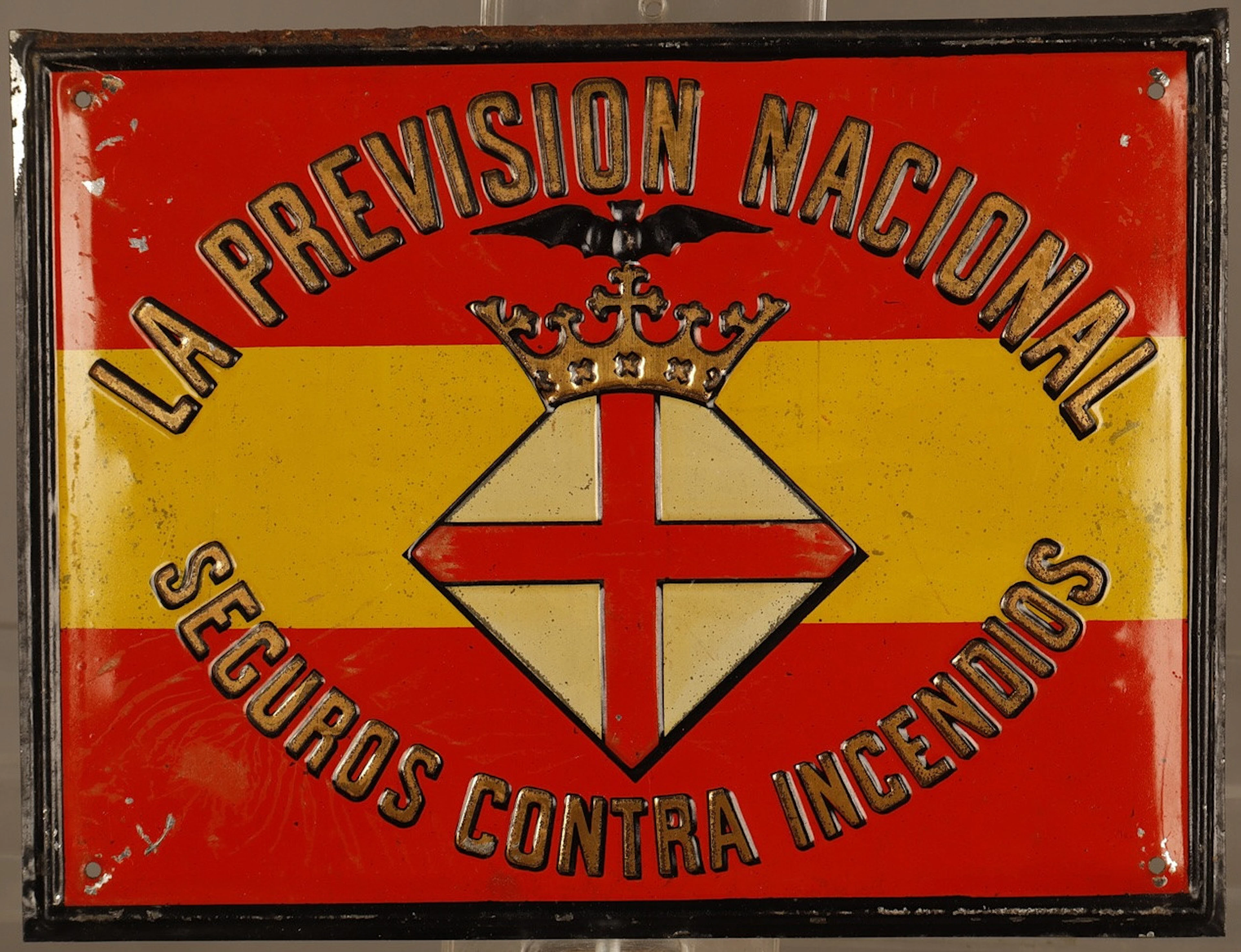 La Previsión Nacional, placa publicitaria en hojalata estampada y pintada.