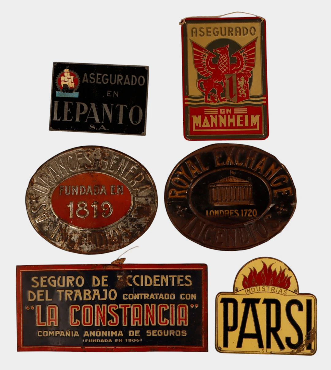 La Constancia y otros, seis placas de seguros en chapa.