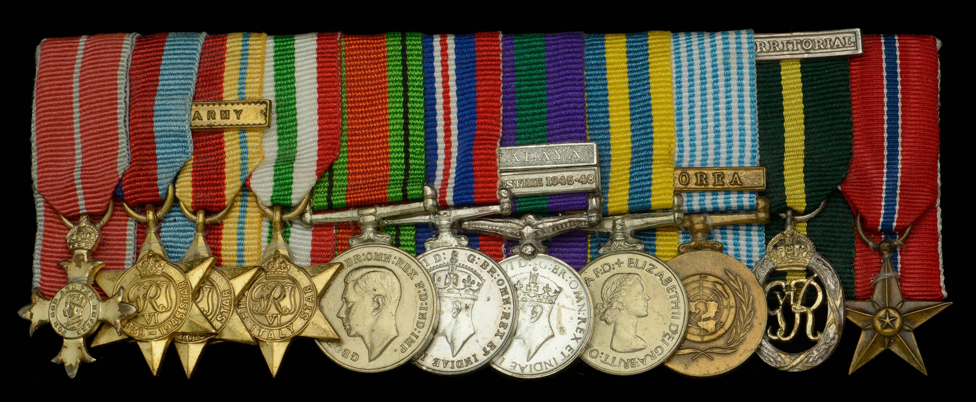 A post-War O.B.E. mounted group of eleven miniature dress medals attributed