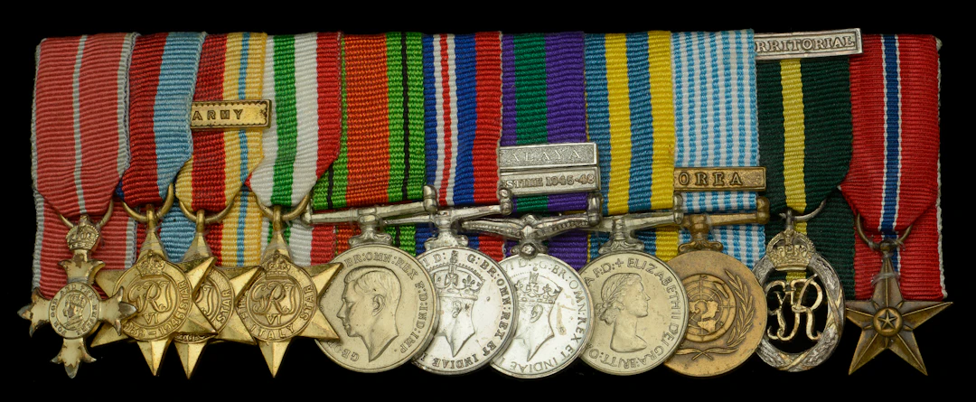 A post-War O.B.E. mounted group of eleven miniature dress medals attributed
