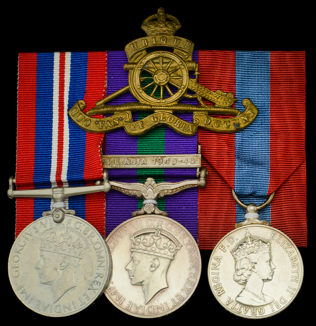 Three: Gunner J. F. Arm, Royal Artillery War Medal 1939-45; General