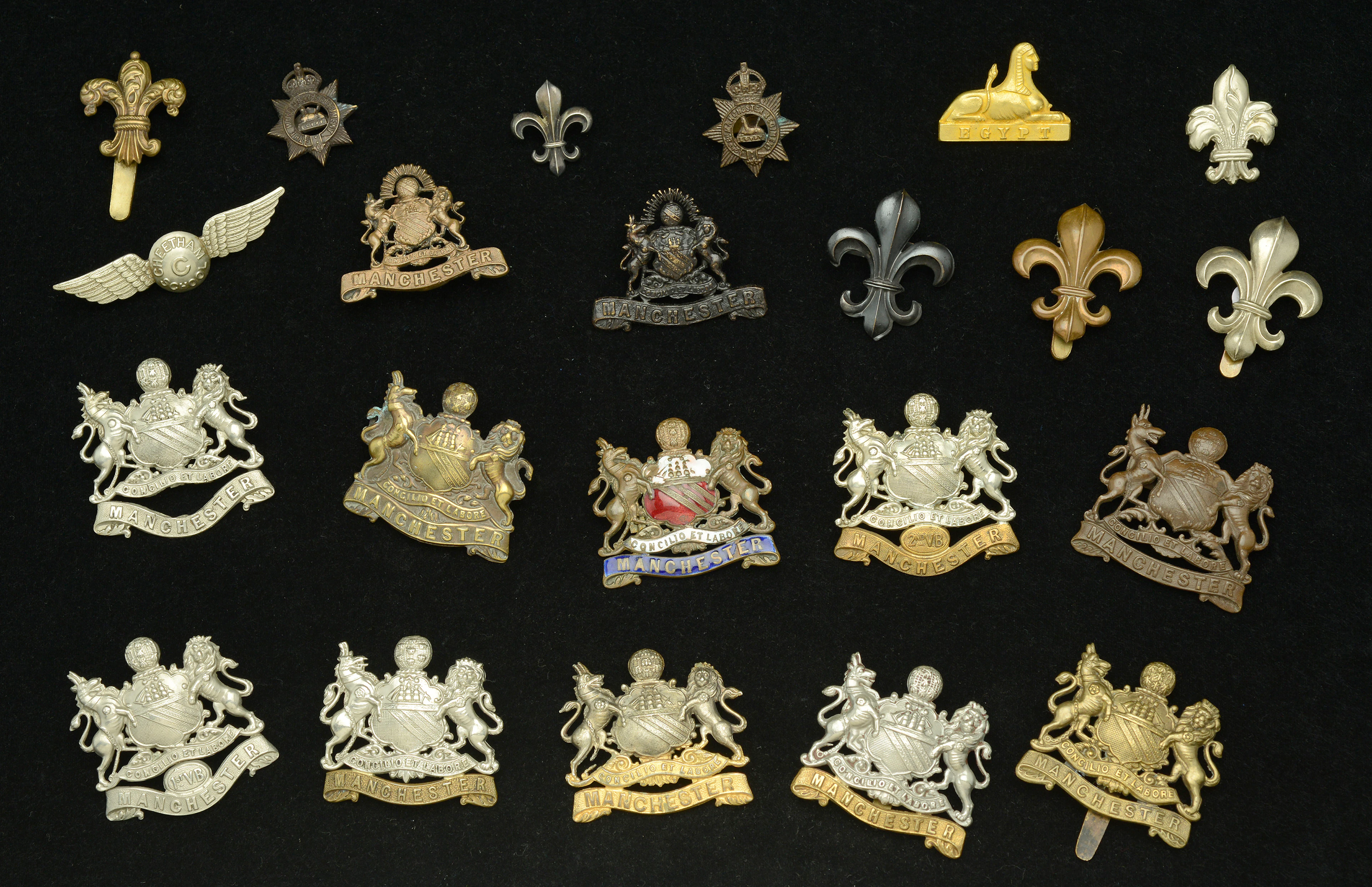 Manchester Regiment, Assorted Cap Badges. A very good selection, with