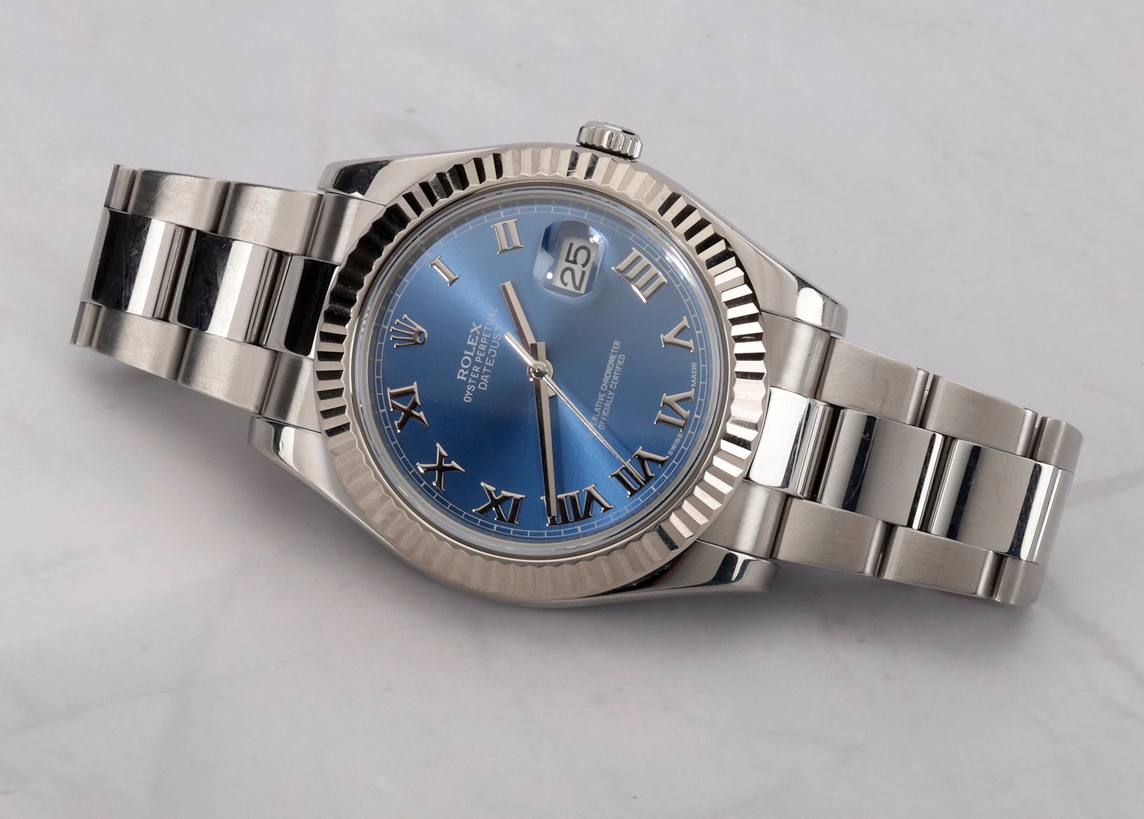 Rolex. A stainless steel automatic wristwatch with date, bracelet