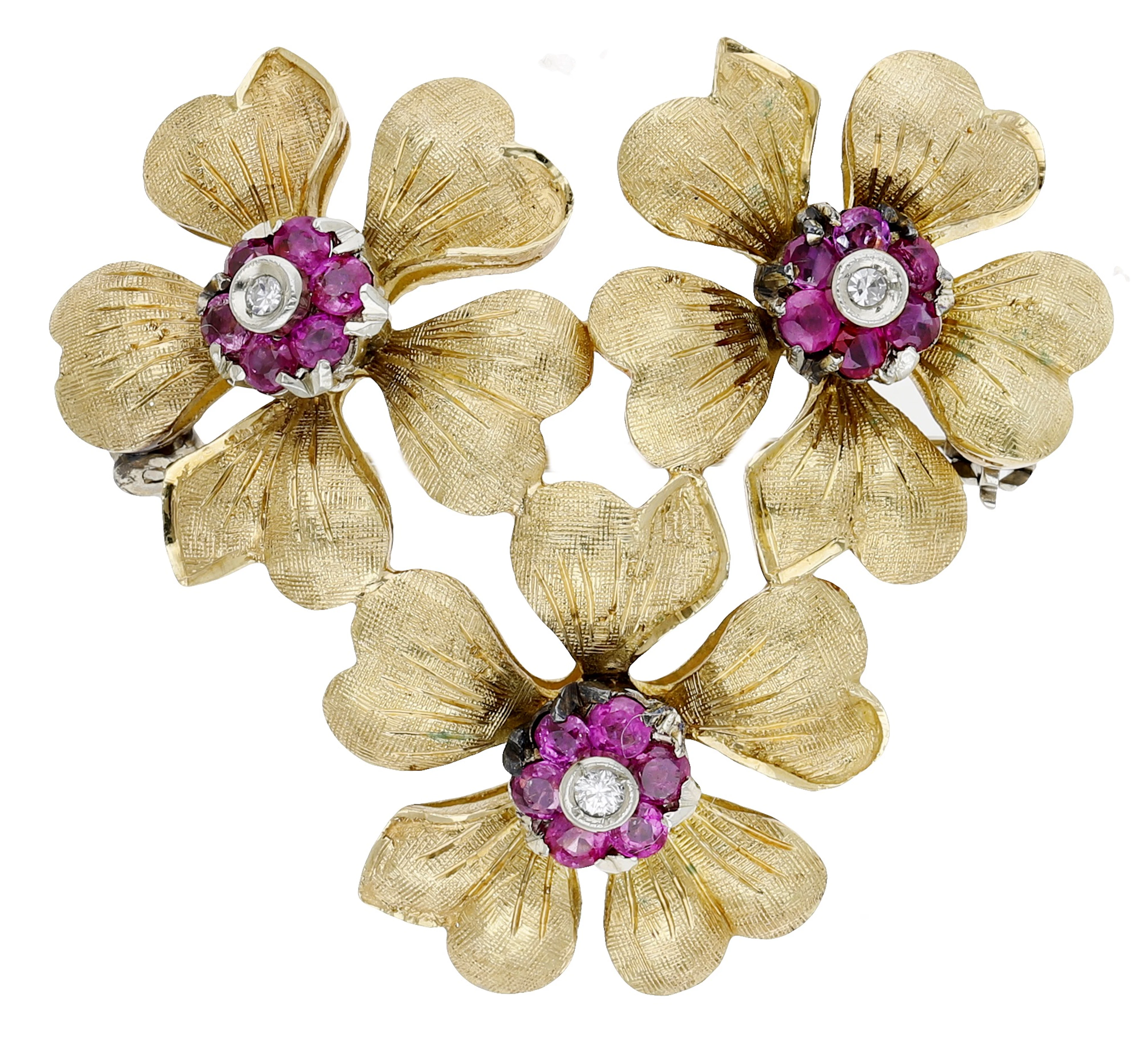 A mid 20th century ruby and diamond brooch, composed of three flowerheads