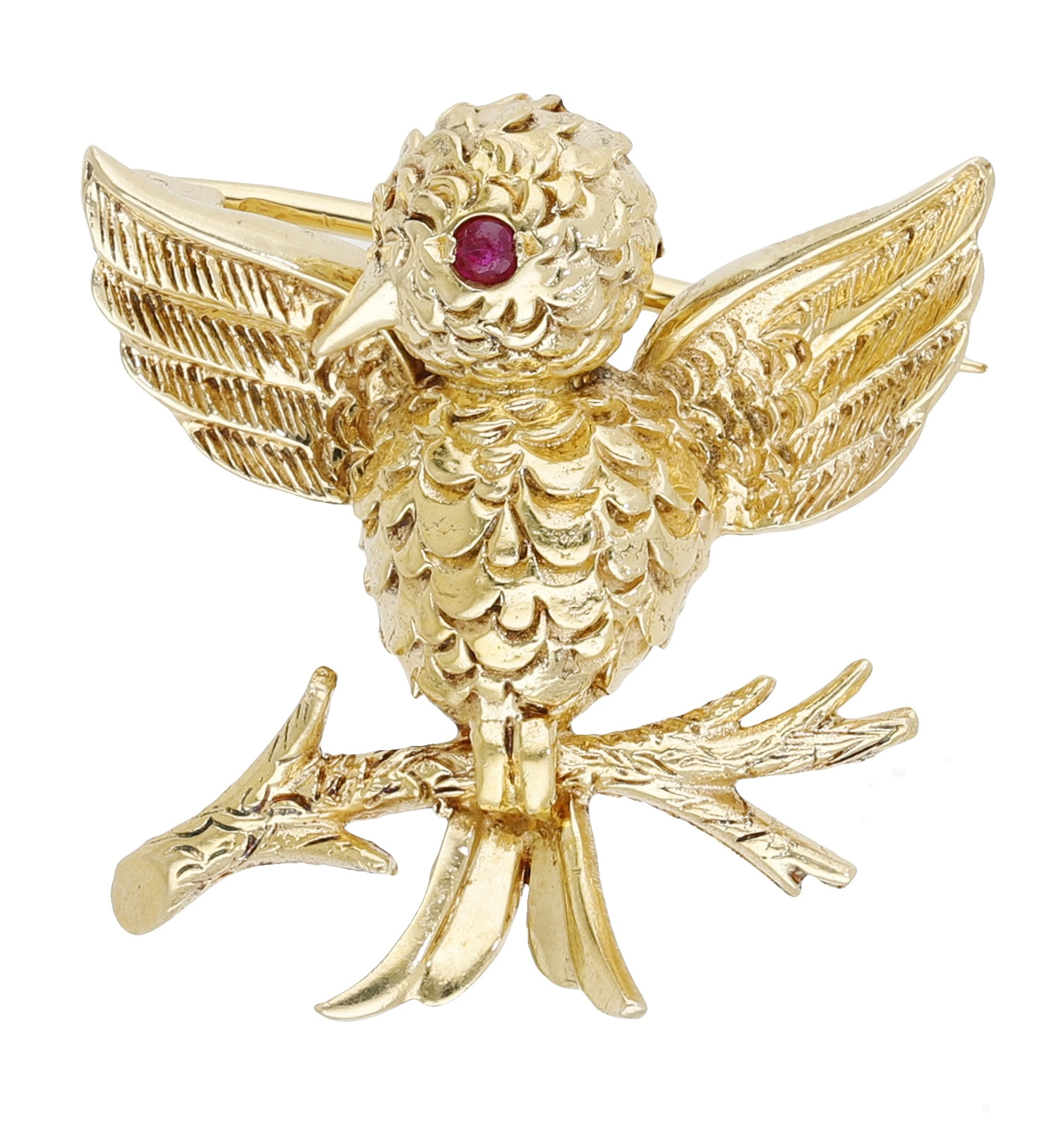 A gold bird brooch by Boucheron, the bird with outstretched wings