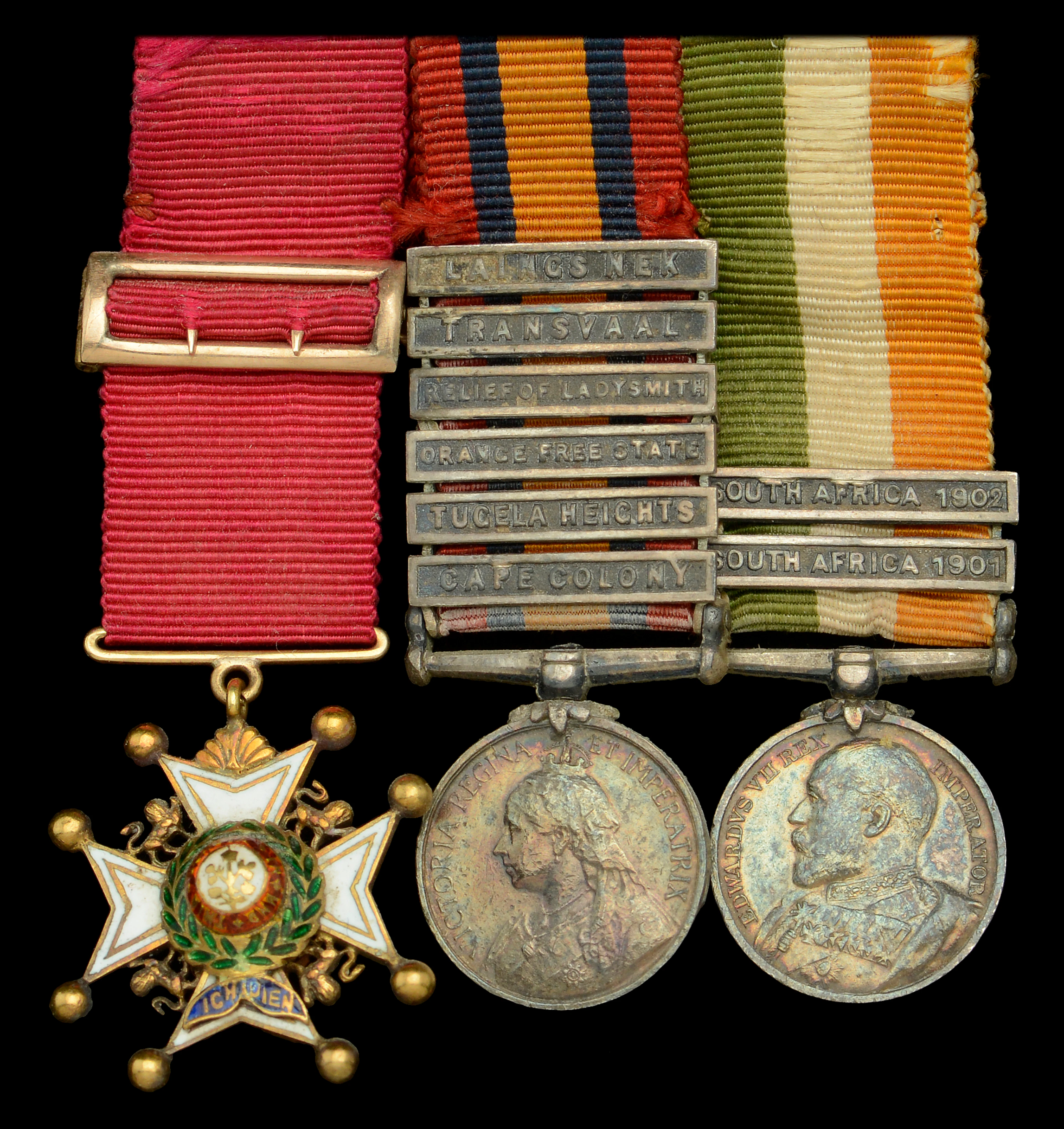 A pre-War C.B. mounted group of three miniature dress medals attributed
