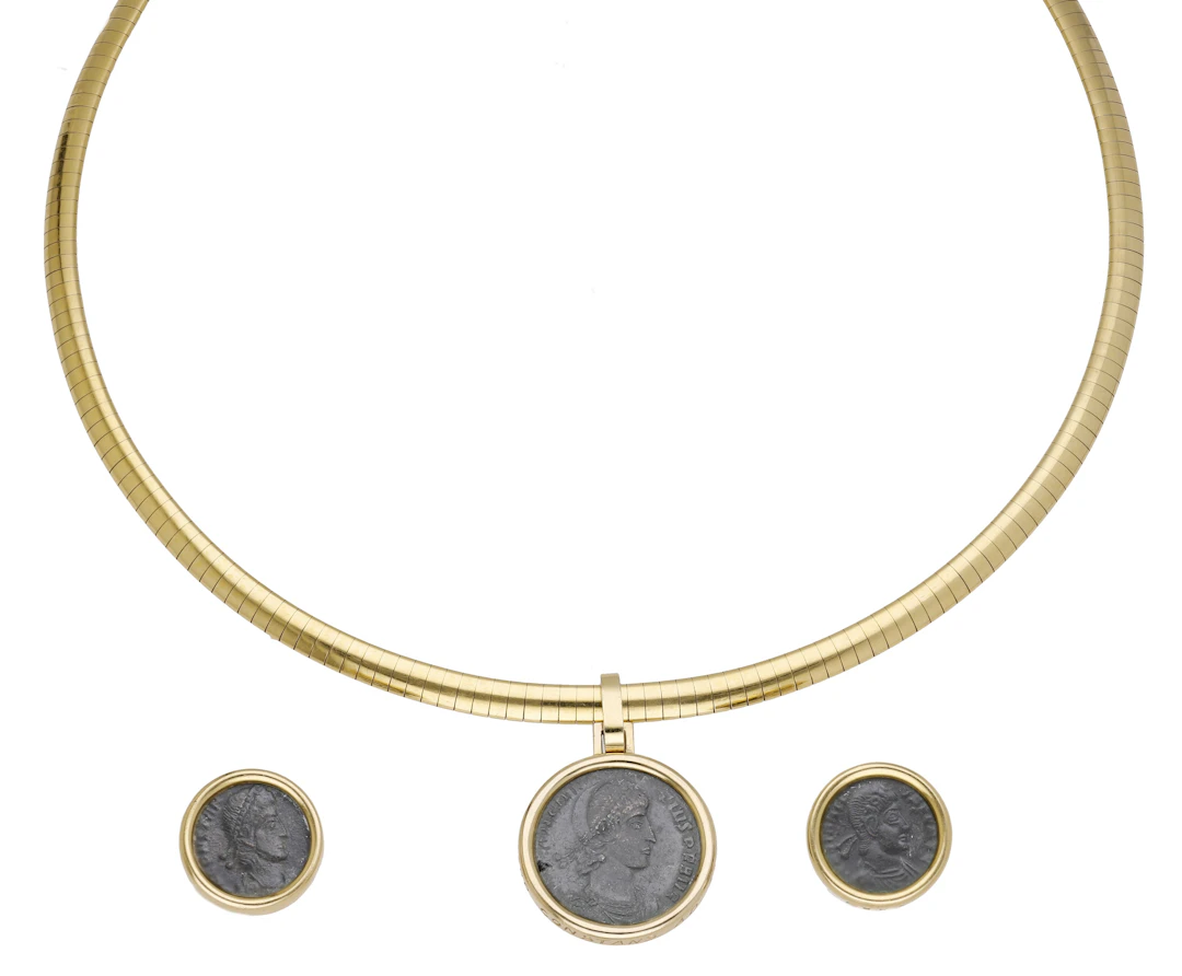 An ancient coin set pendant necklace and a pair of ear clips, the