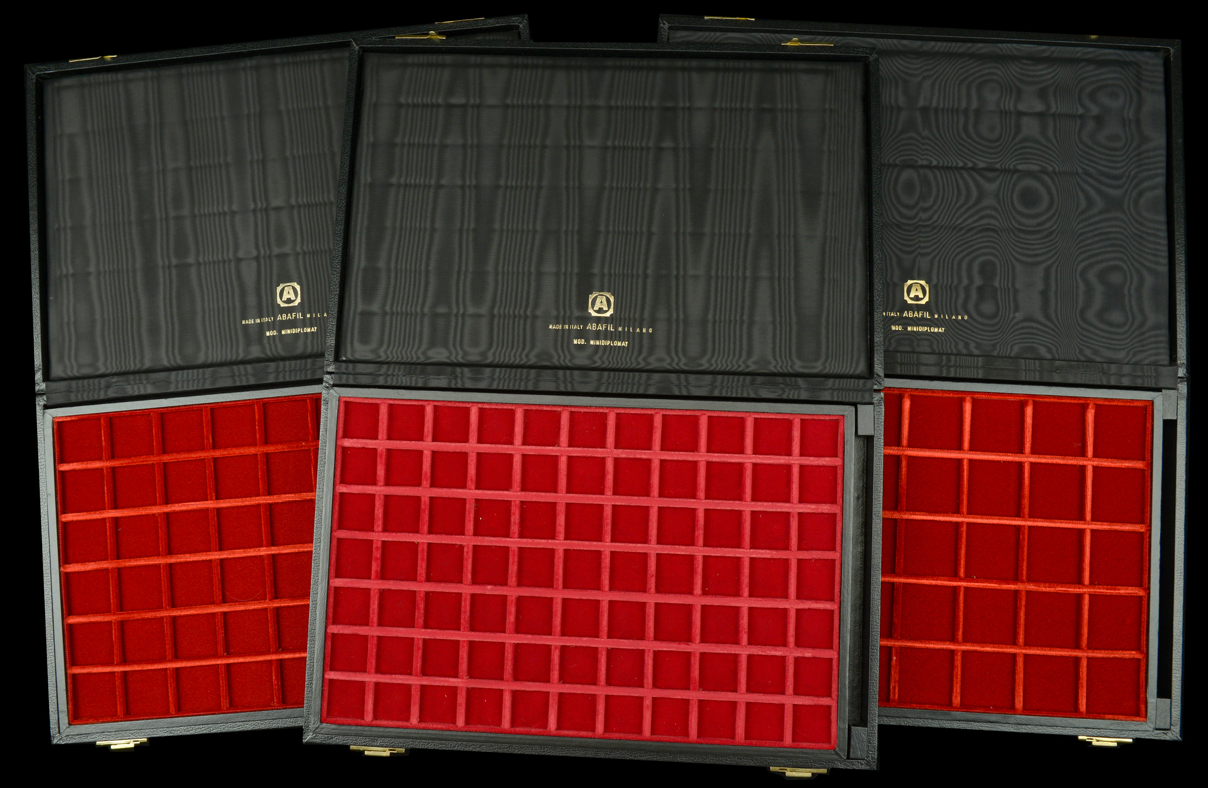 A trio of Abafil Minidiplomat cases (3), each with two loose trays